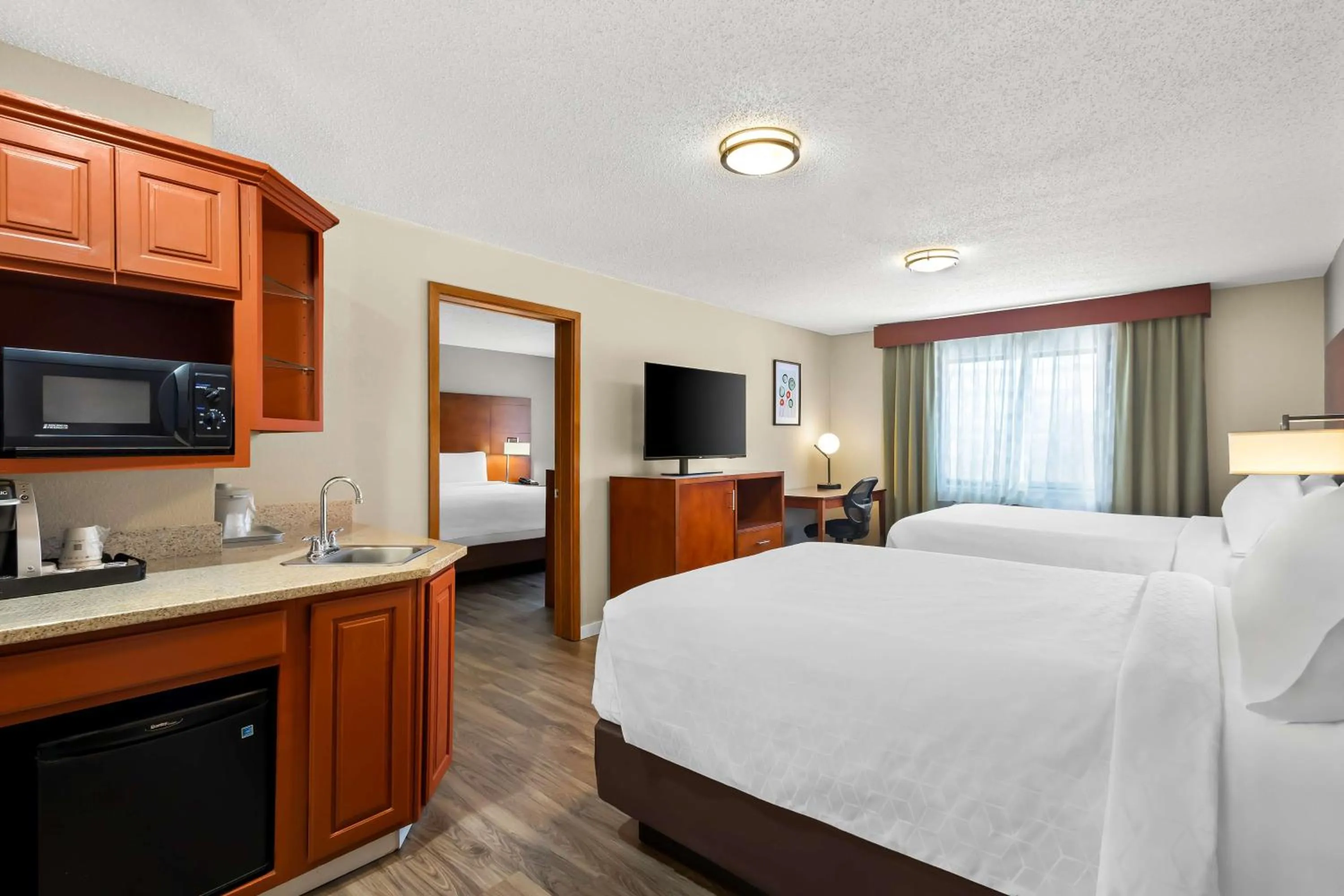 Photo of the whole room, Bed in SureStay Plus by Best Western Fremont I-69