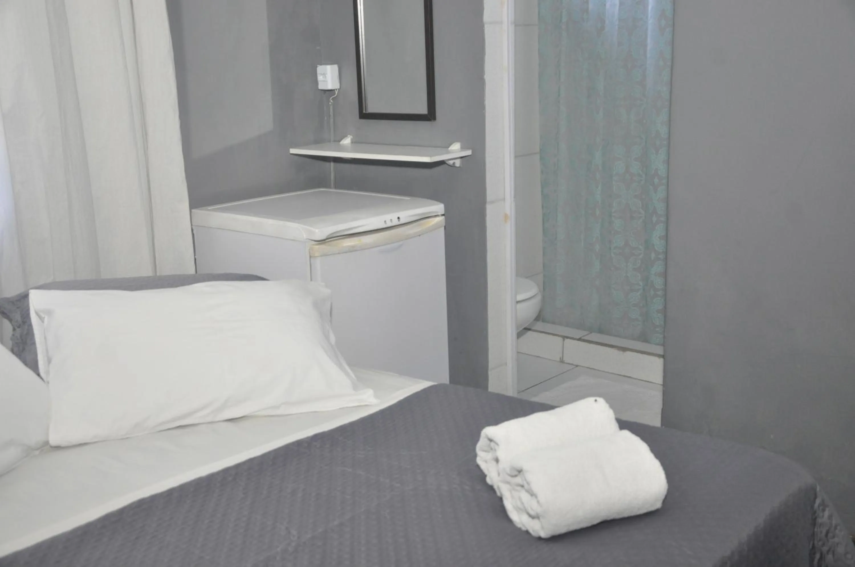 Bed in Pousada My House Cabo Frio