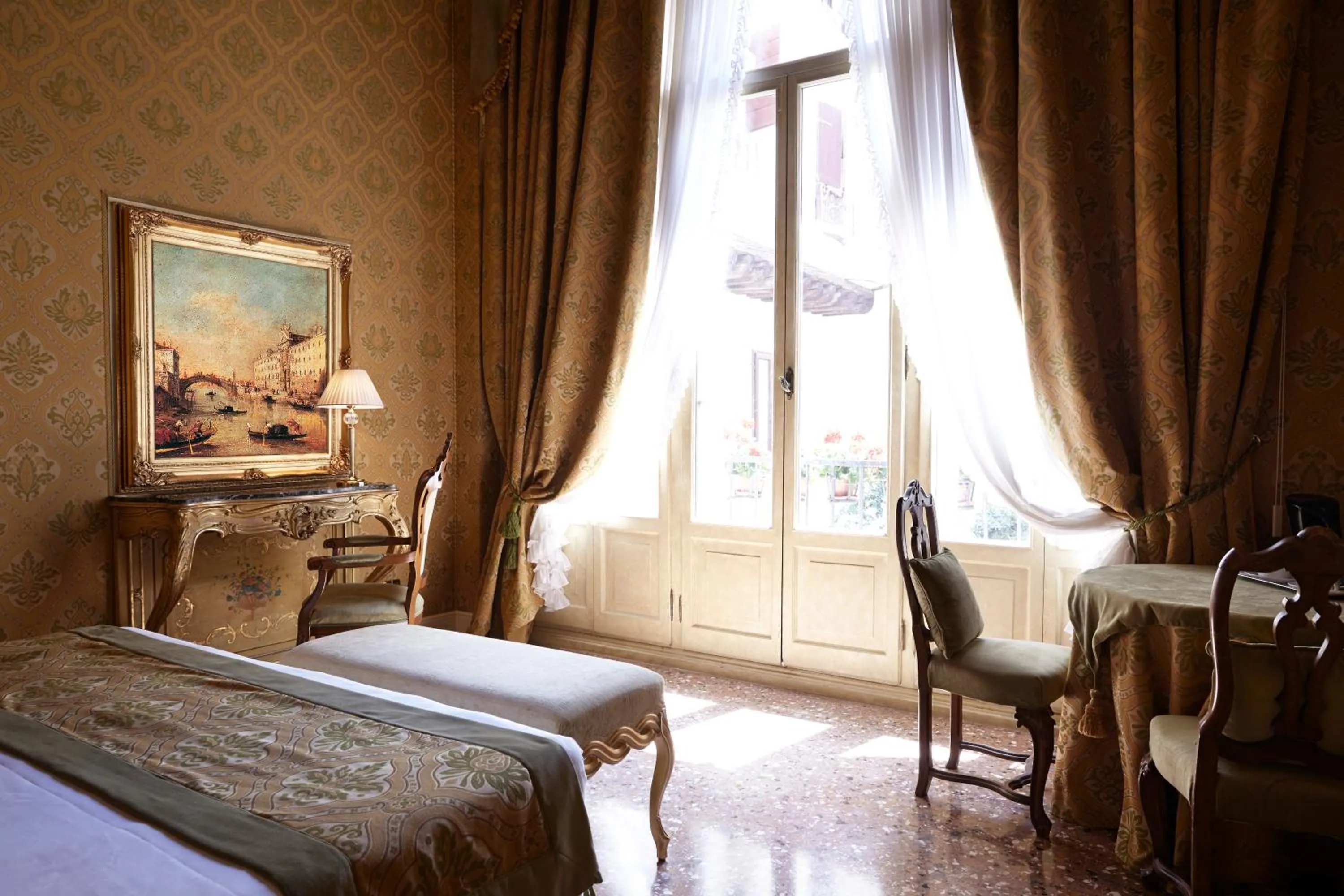 Bed in Palazzo Paruta & Wellness Suites