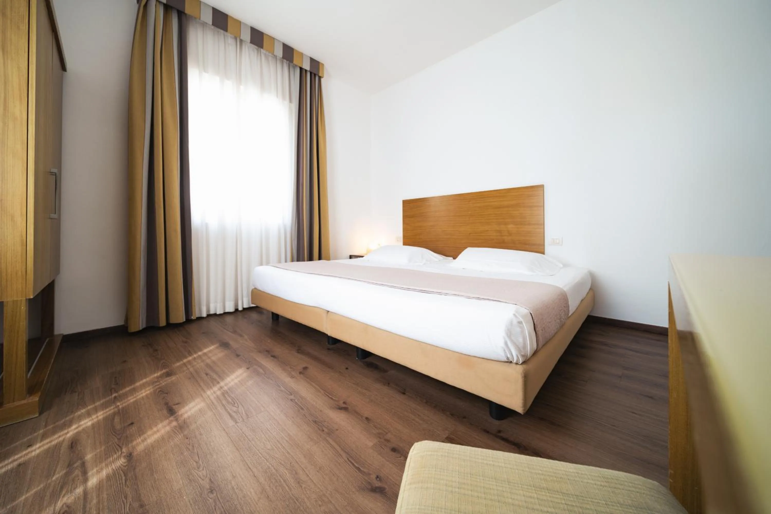 Photo of the whole room, Bed in Hotel Trieste