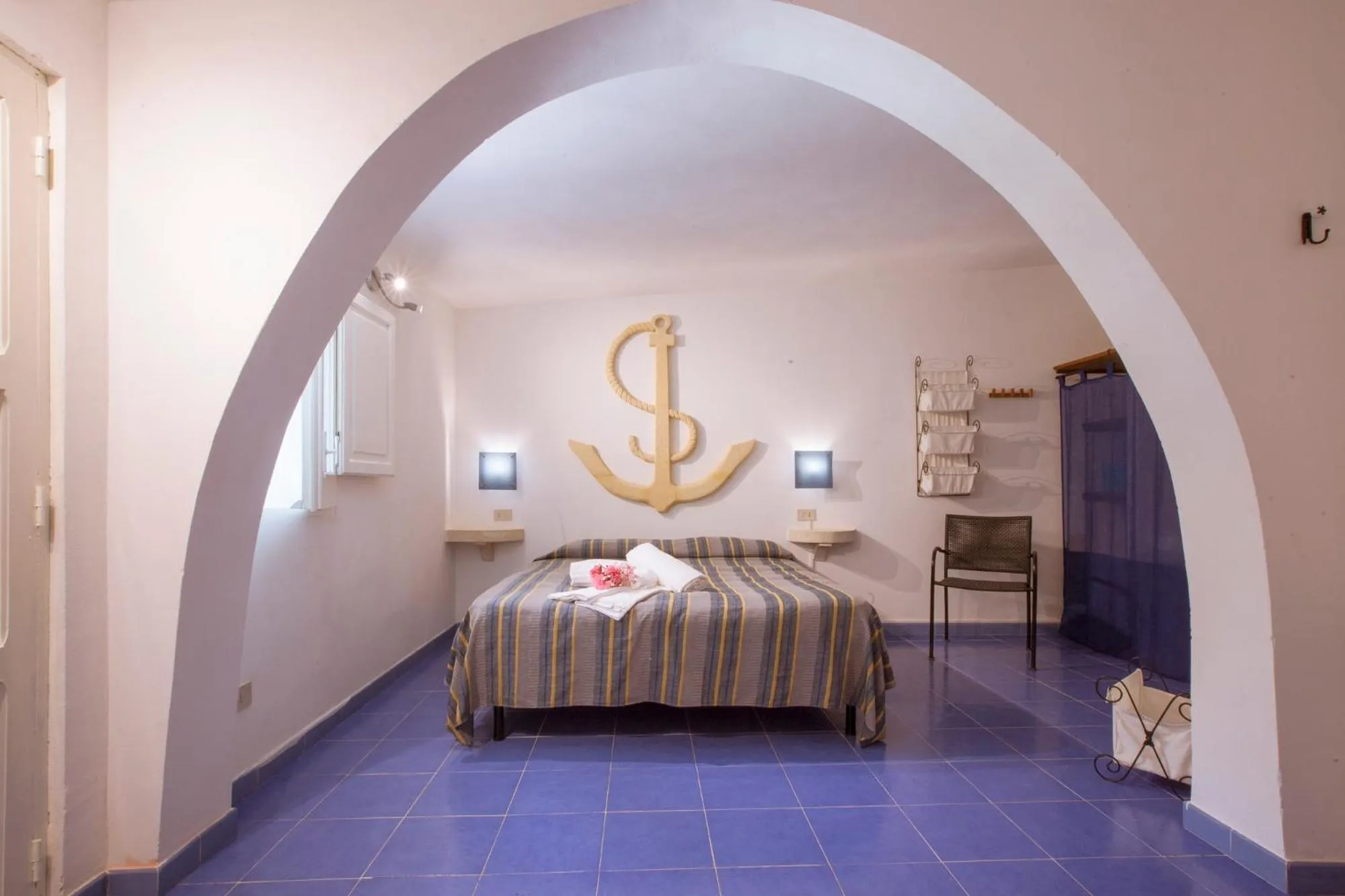 Bedroom in L'Oasi Villaggio Albergo