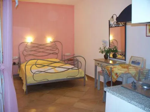 Bed in Annita's Village Hotel