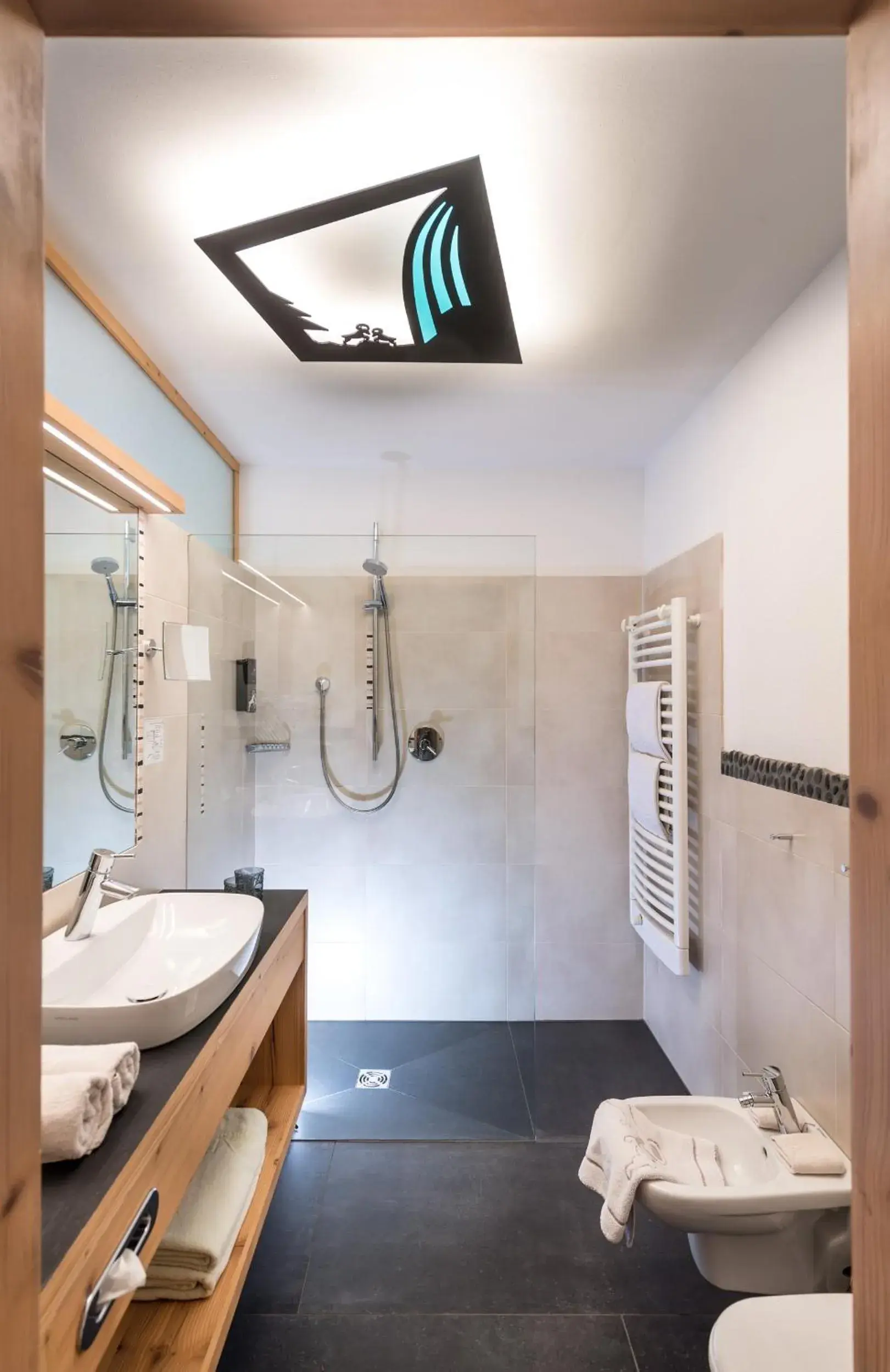 Bathroom in ABINEA Dolomiti Romantic SPA Bathroom in ABINEA Dolomiti Romantic SPA