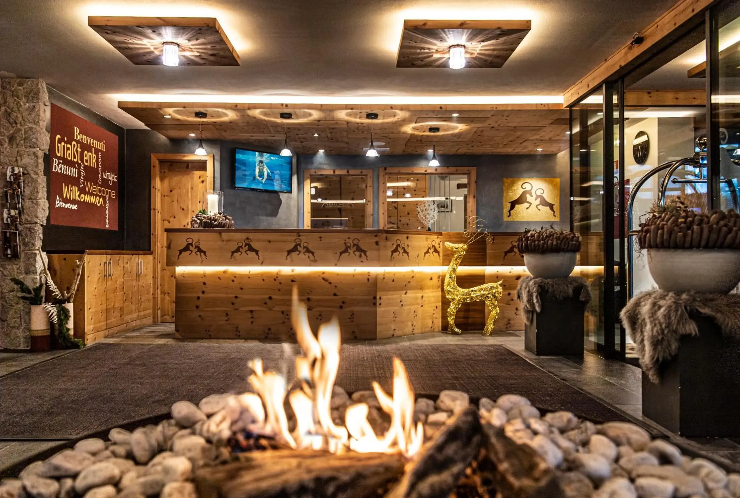 Lobby or reception in ABINEA Dolomiti Romantic SPA Lobby or reception in ABINEA Dolomiti Romantic SPA