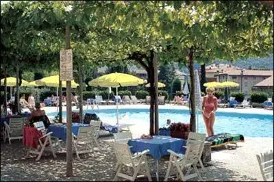 Patio, Swimming Pool in Hotel Garden