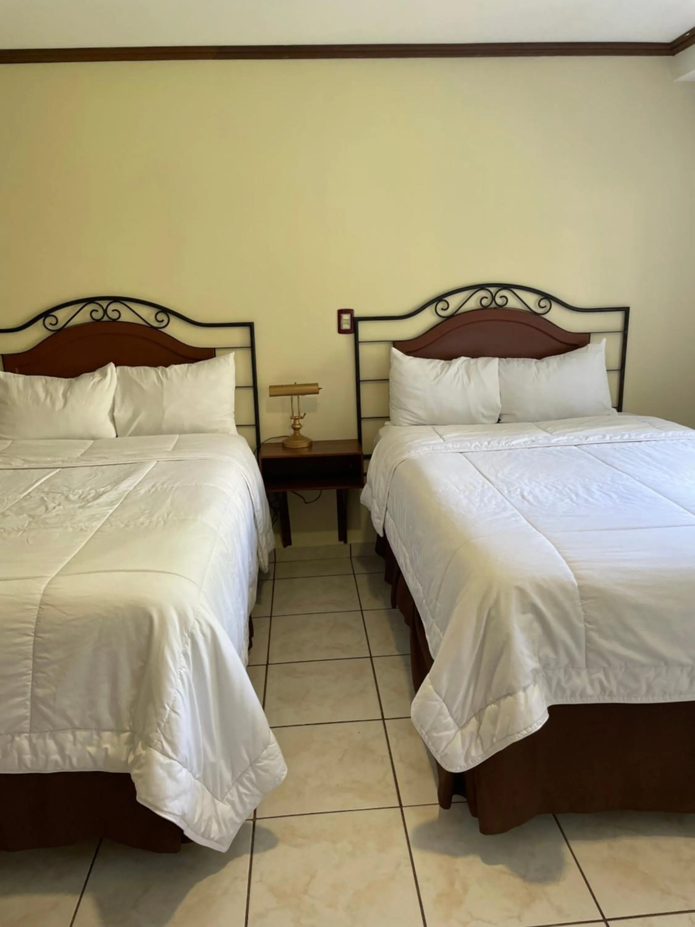 Bed in Hotel Gardenia Inn