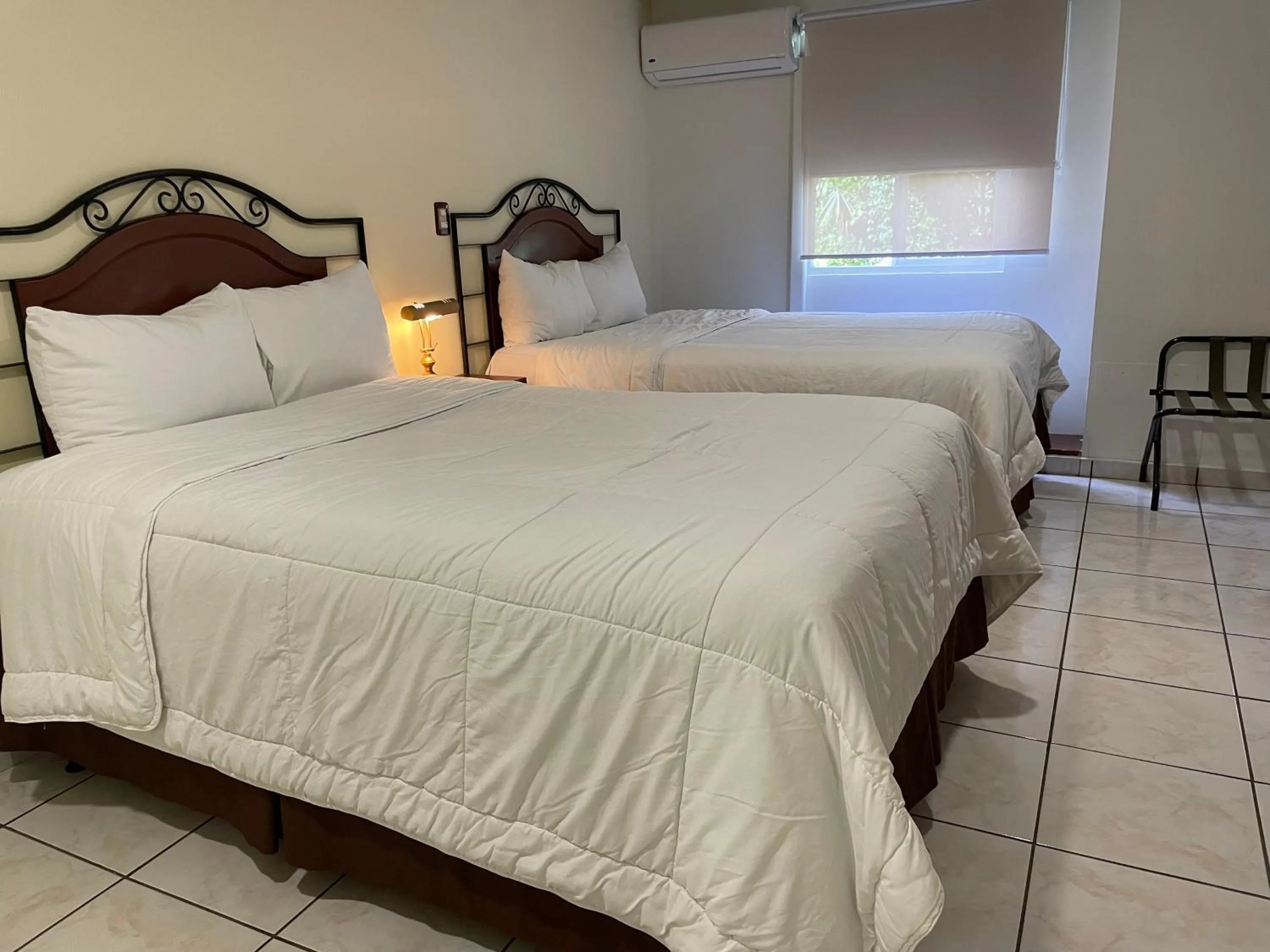 Bed in Hotel Gardenia Inn