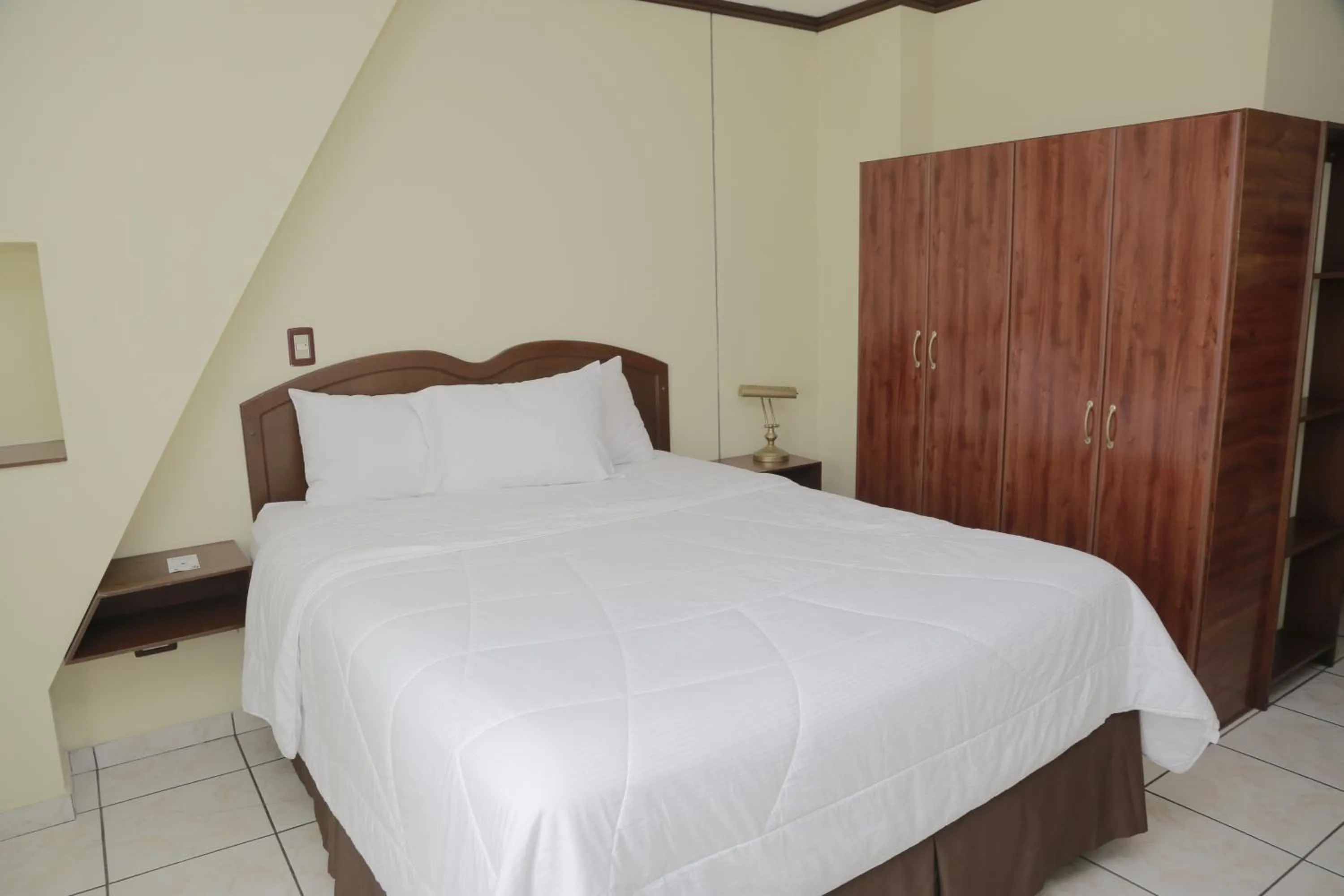 Bed in Hotel Gardenia Inn