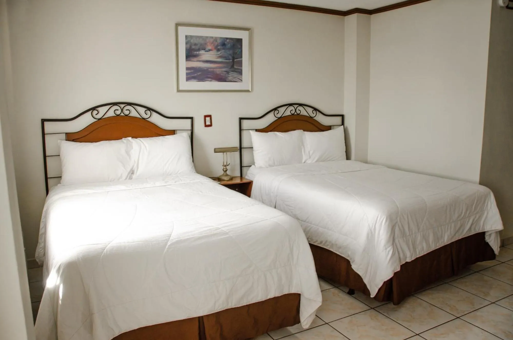 Bed in Hotel Gardenia Inn
