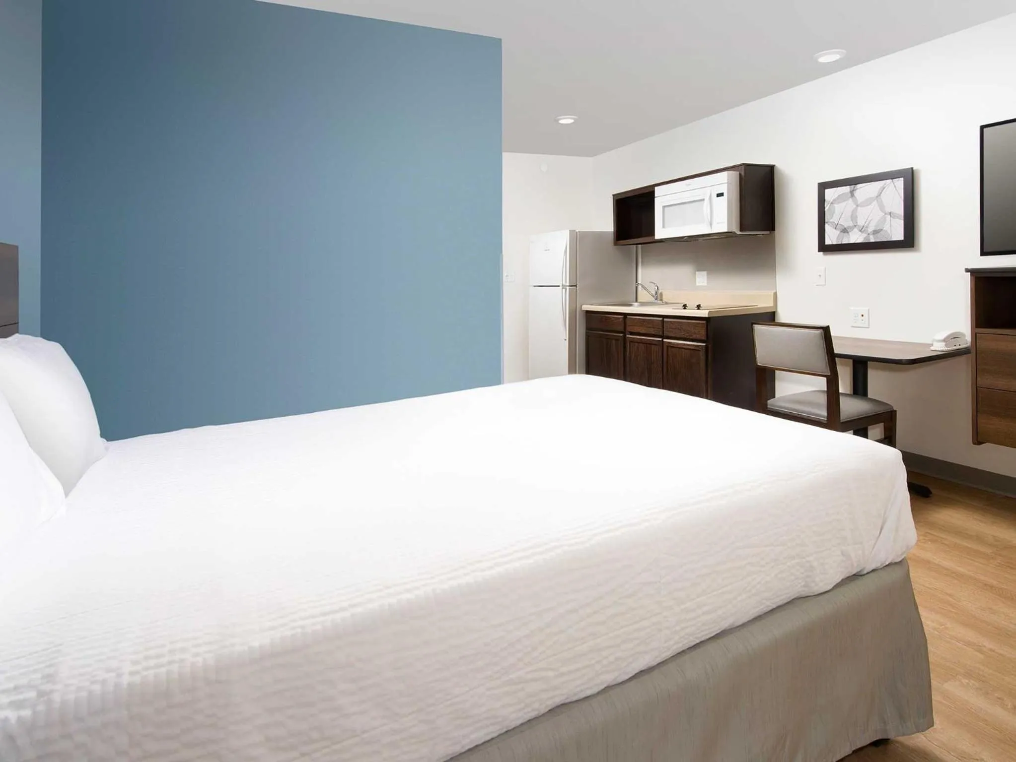 Photo of the whole room, Bed in WoodSpring Suites Fargo North Near NDSU