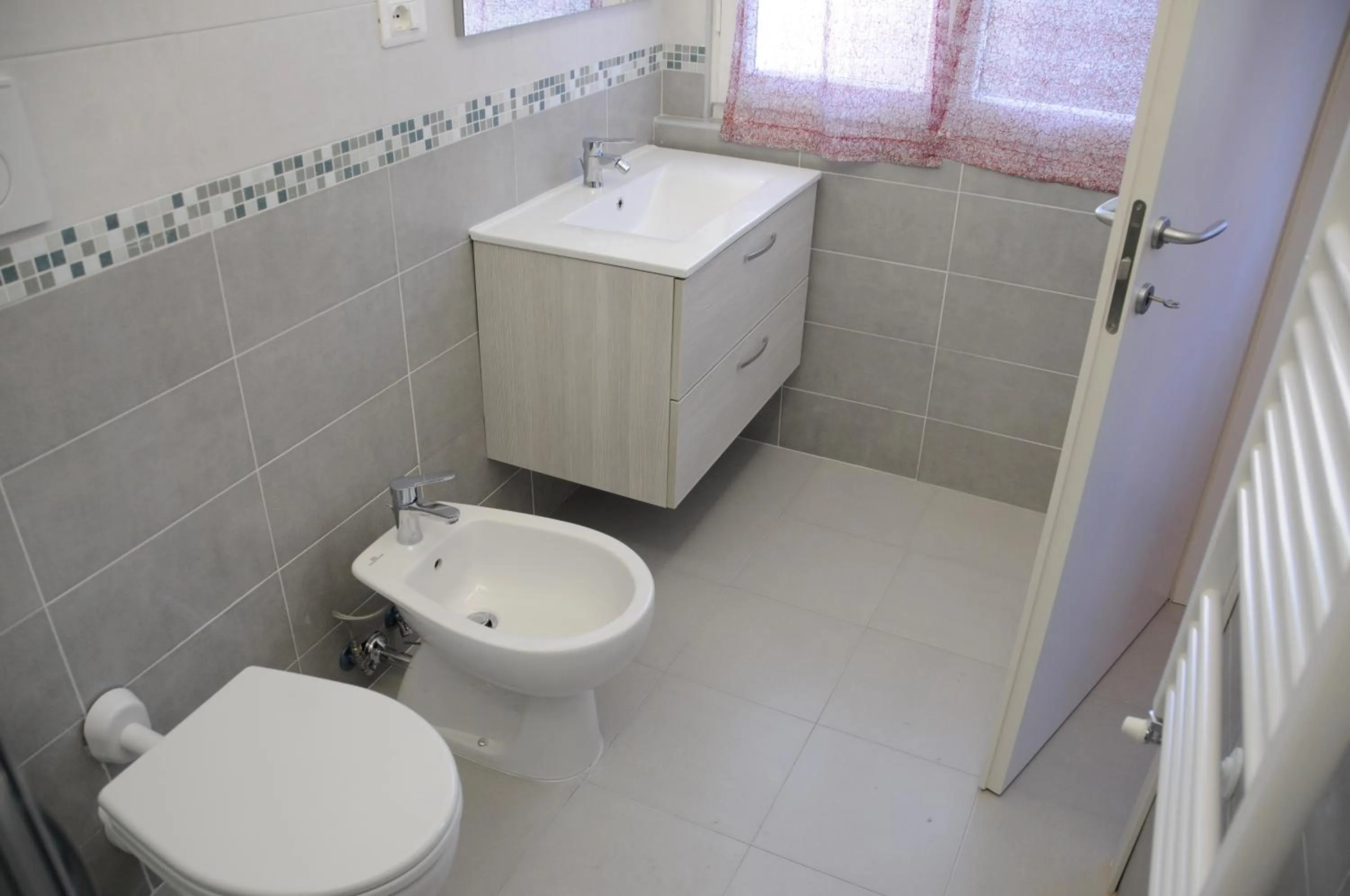 Bathroom in Affittacamere La Perla