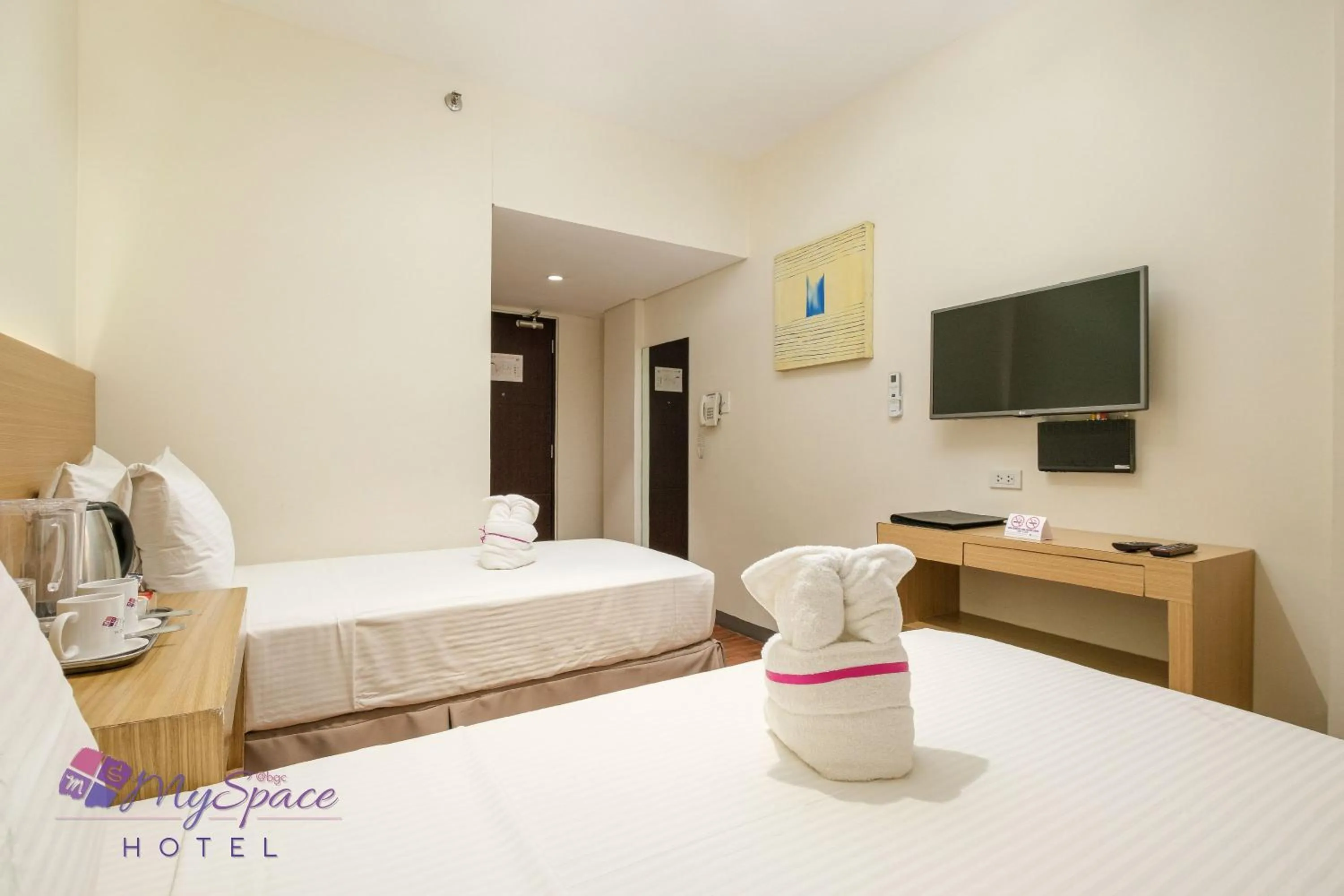 Photo of the whole room, Bed in MySpace Hotel @BGC