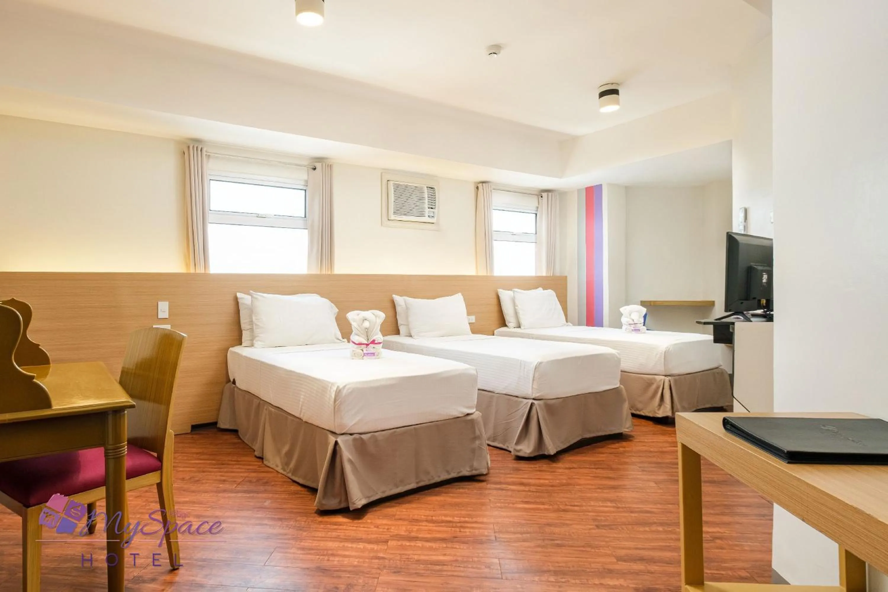 Photo of the whole room, Bed in MySpace Hotel @BGC