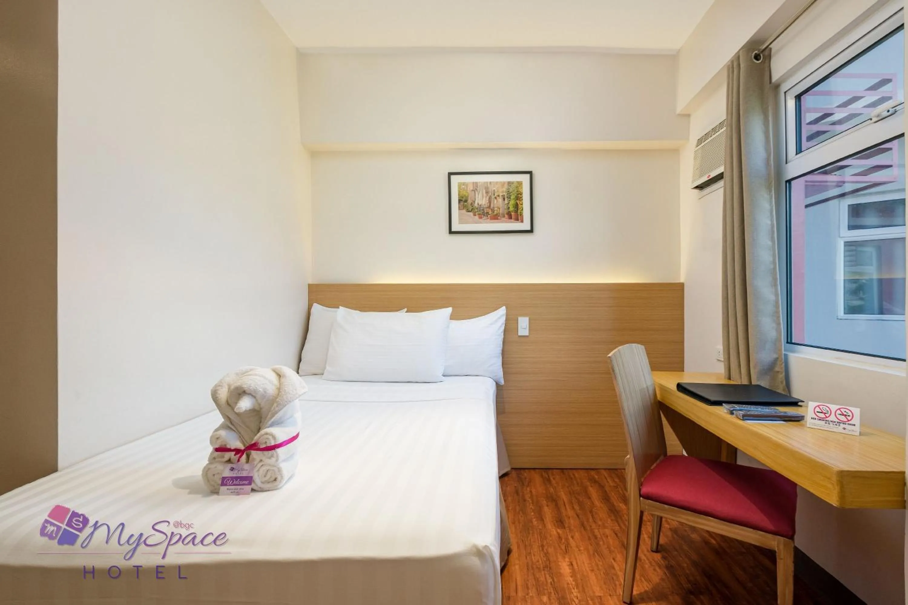 Photo of the whole room, Bed in MySpace Hotel @BGC