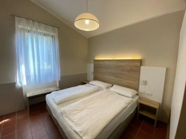 Bedroom in Residence Parco Del Garda