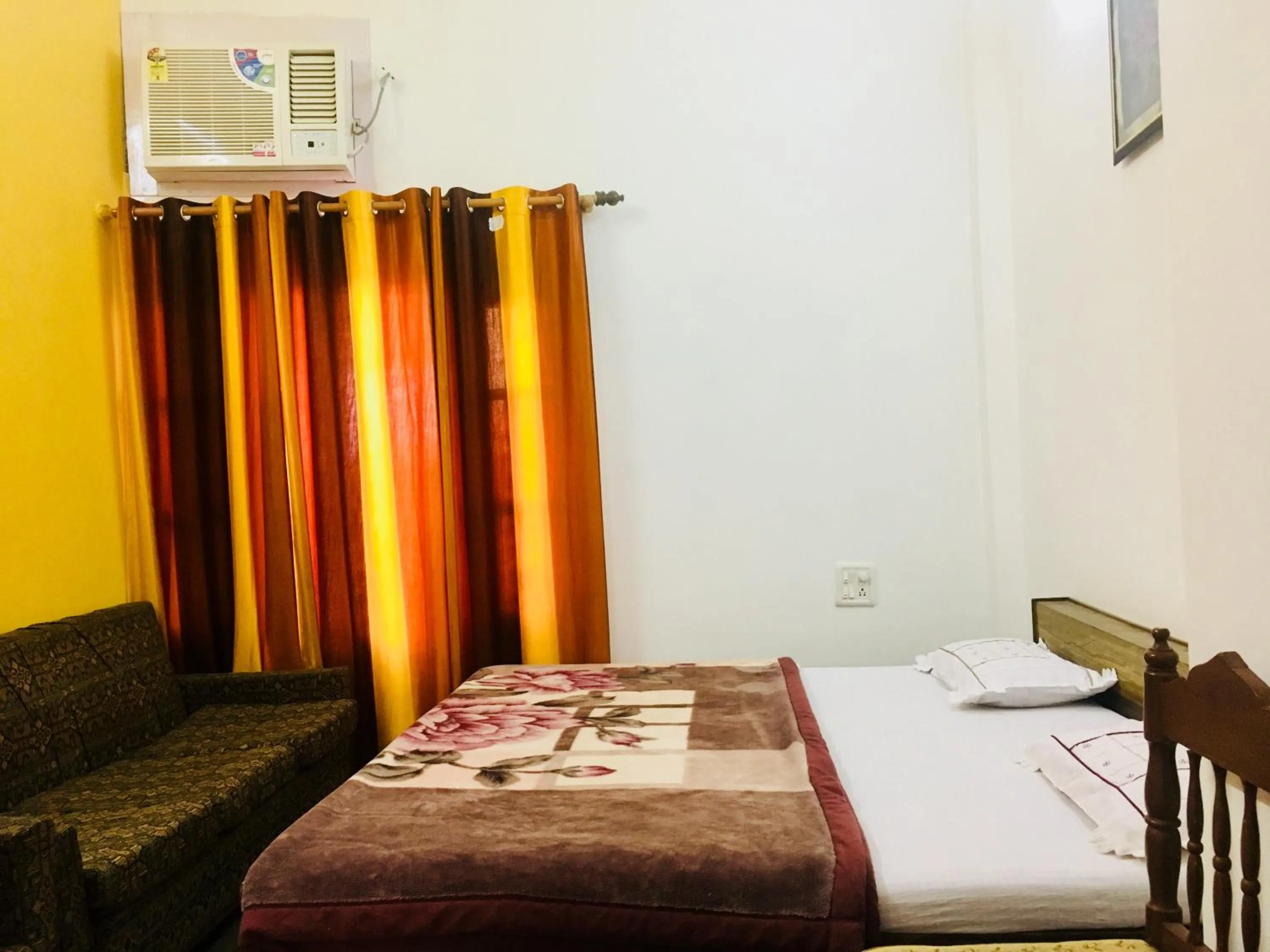 Bed in Hotel Heritage Sanyam