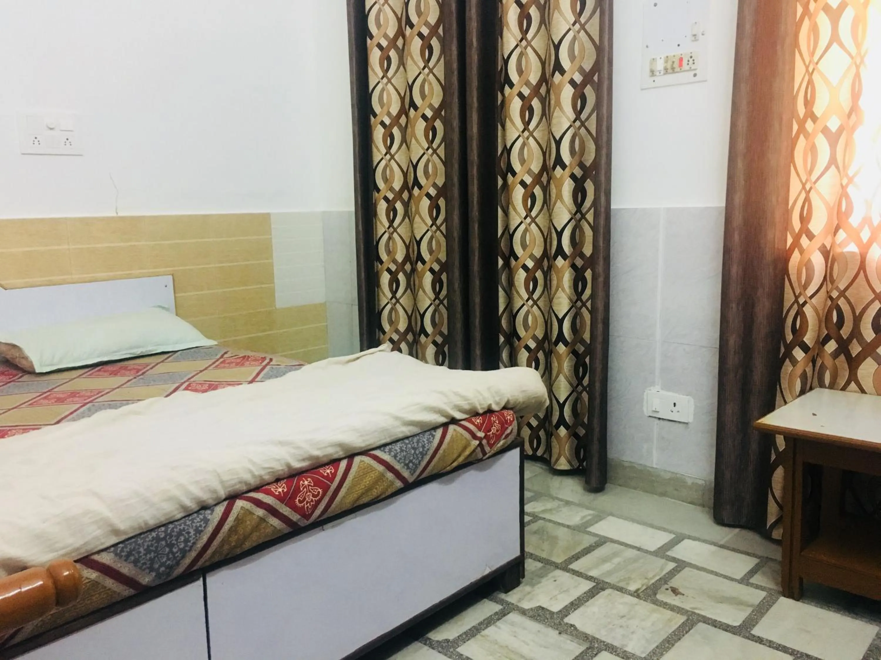 Bed in Hotel Heritage Sanyam