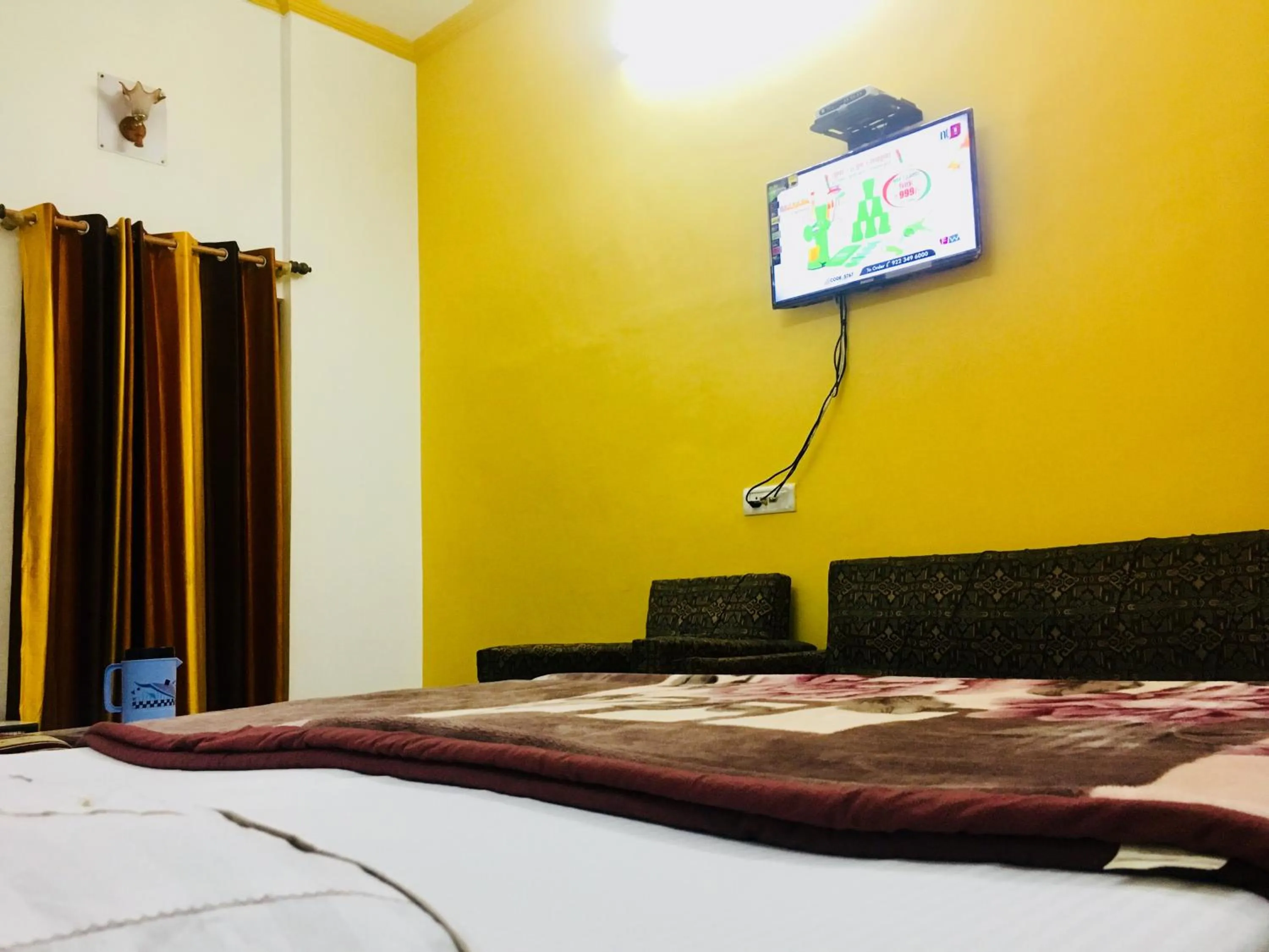 Bed in Hotel Heritage Sanyam