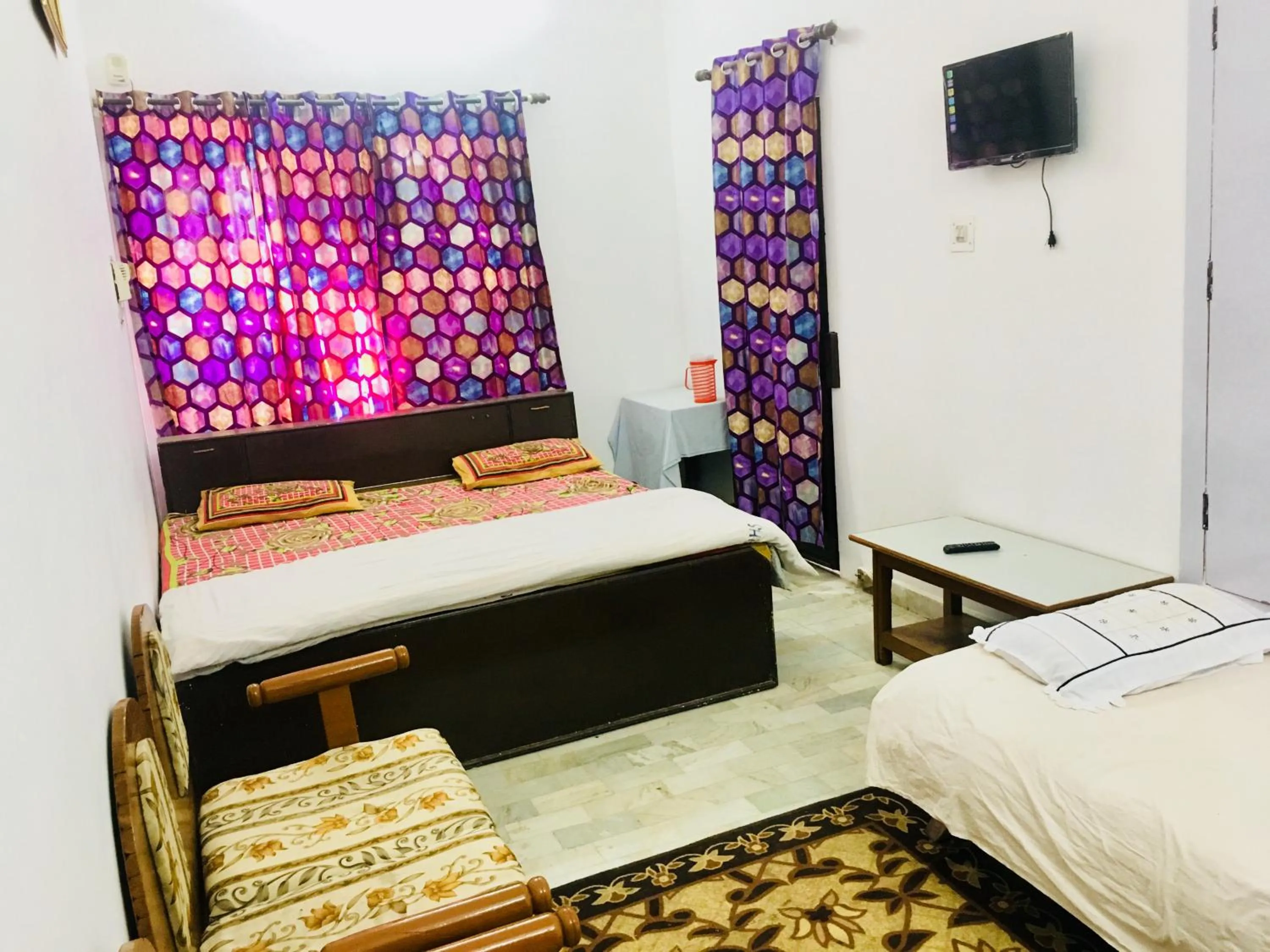 Bed in Hotel Heritage Sanyam