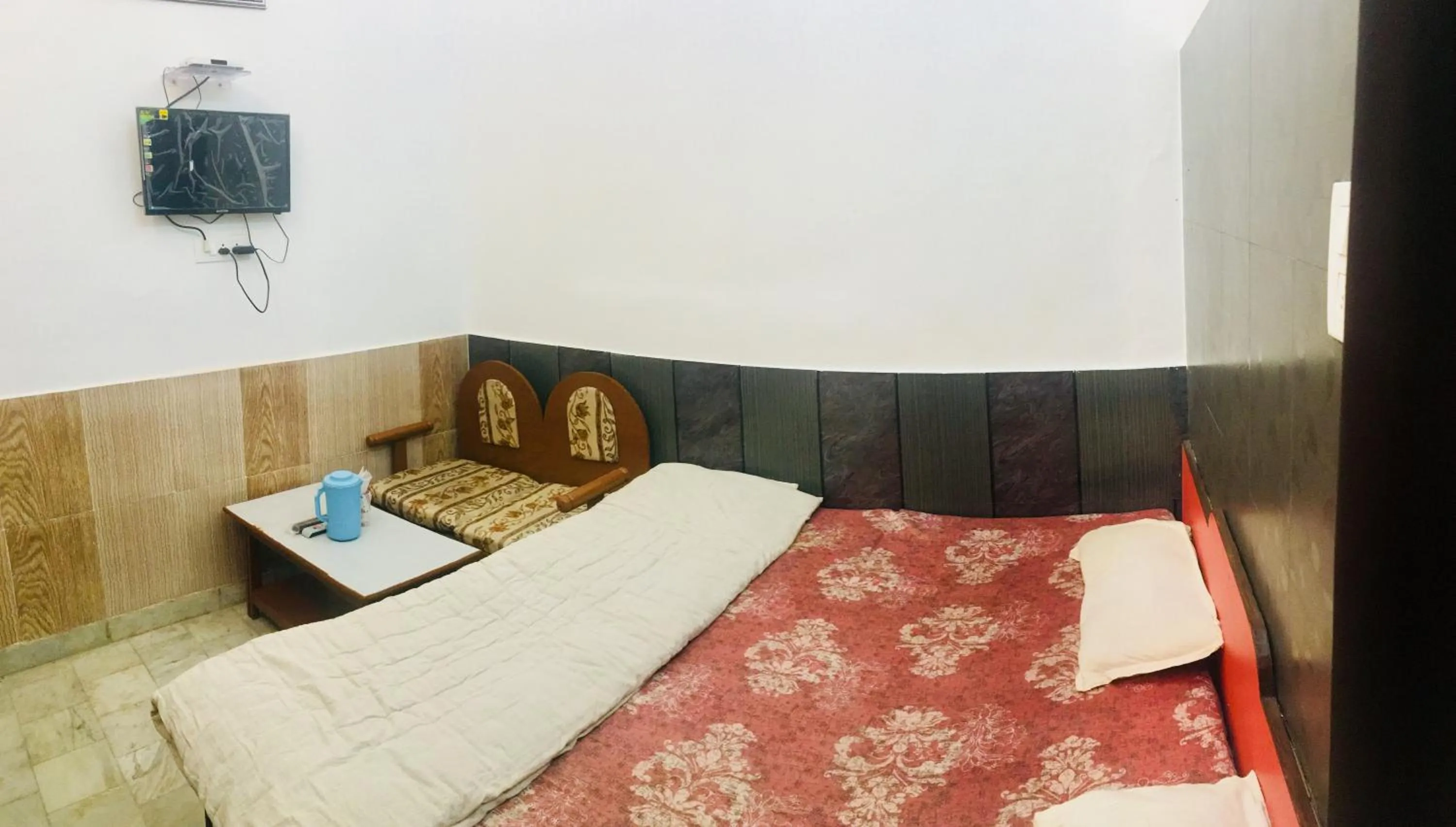 Bed in Hotel Heritage Sanyam