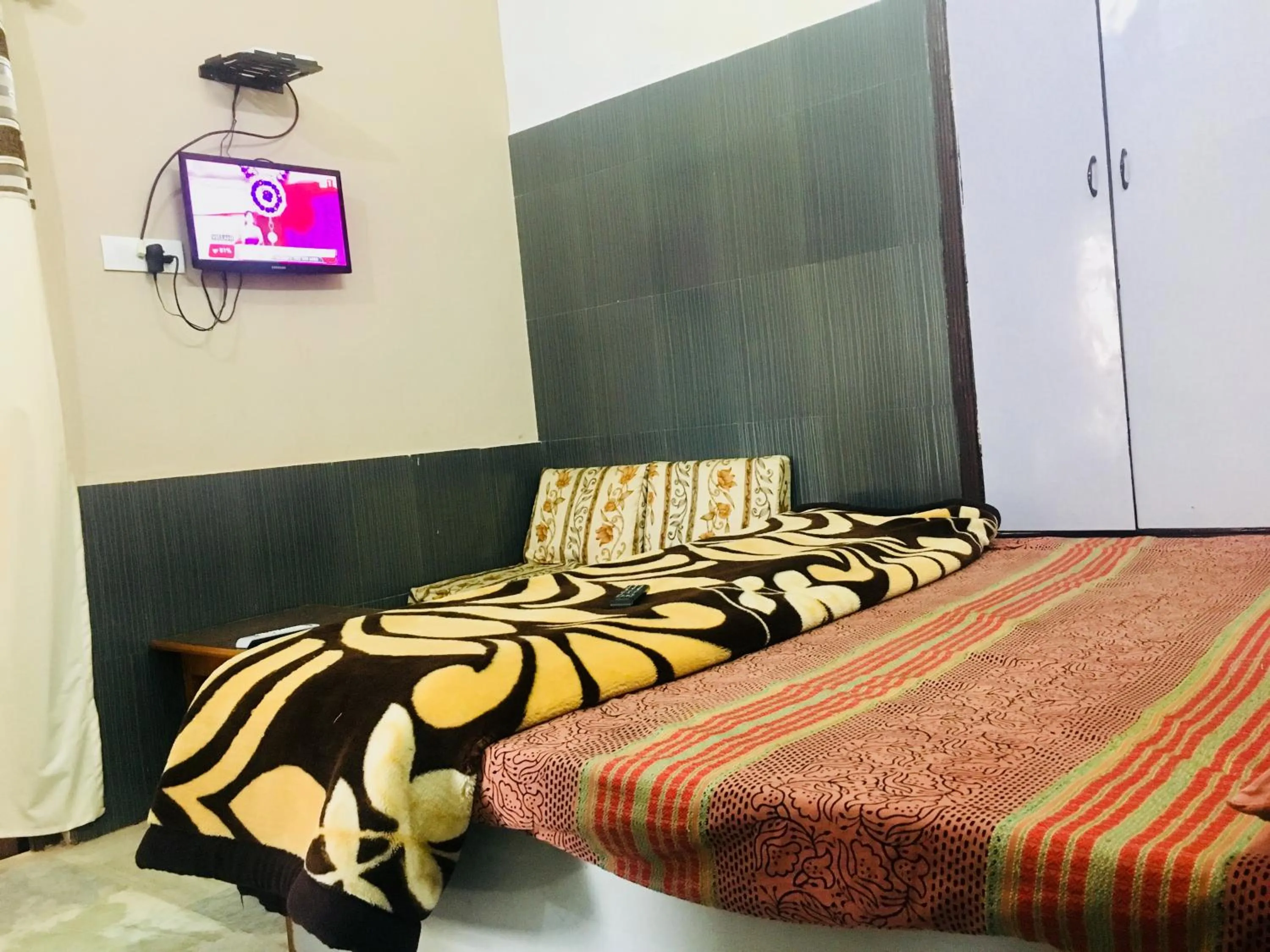Bed in Hotel Heritage Sanyam