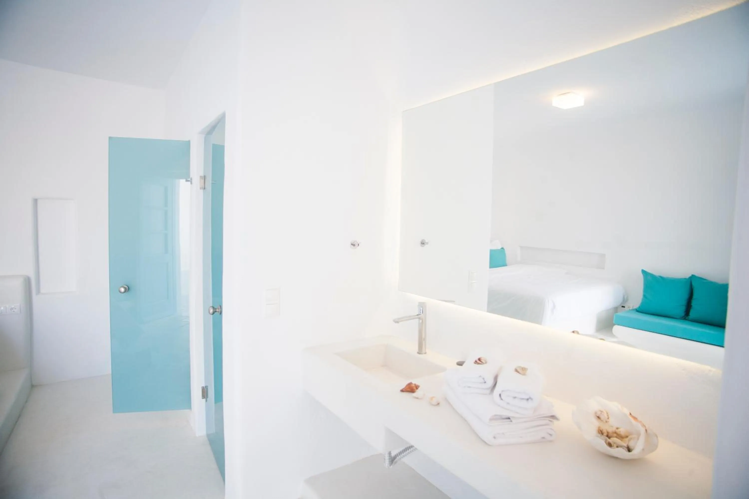 Text overlay, Bed in Mykonos Moussa