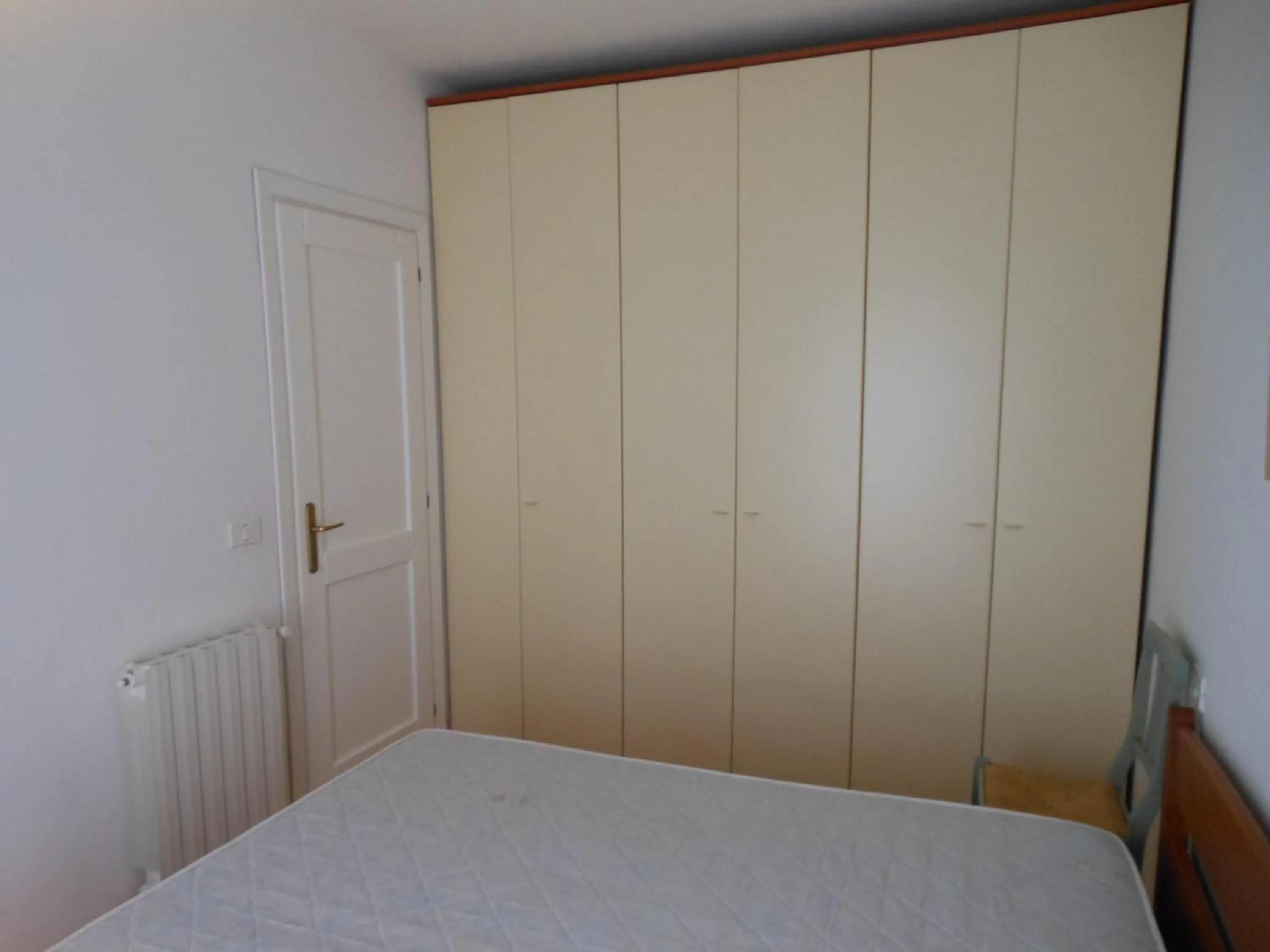 Photo of the whole room, Bed in Cala Delfino