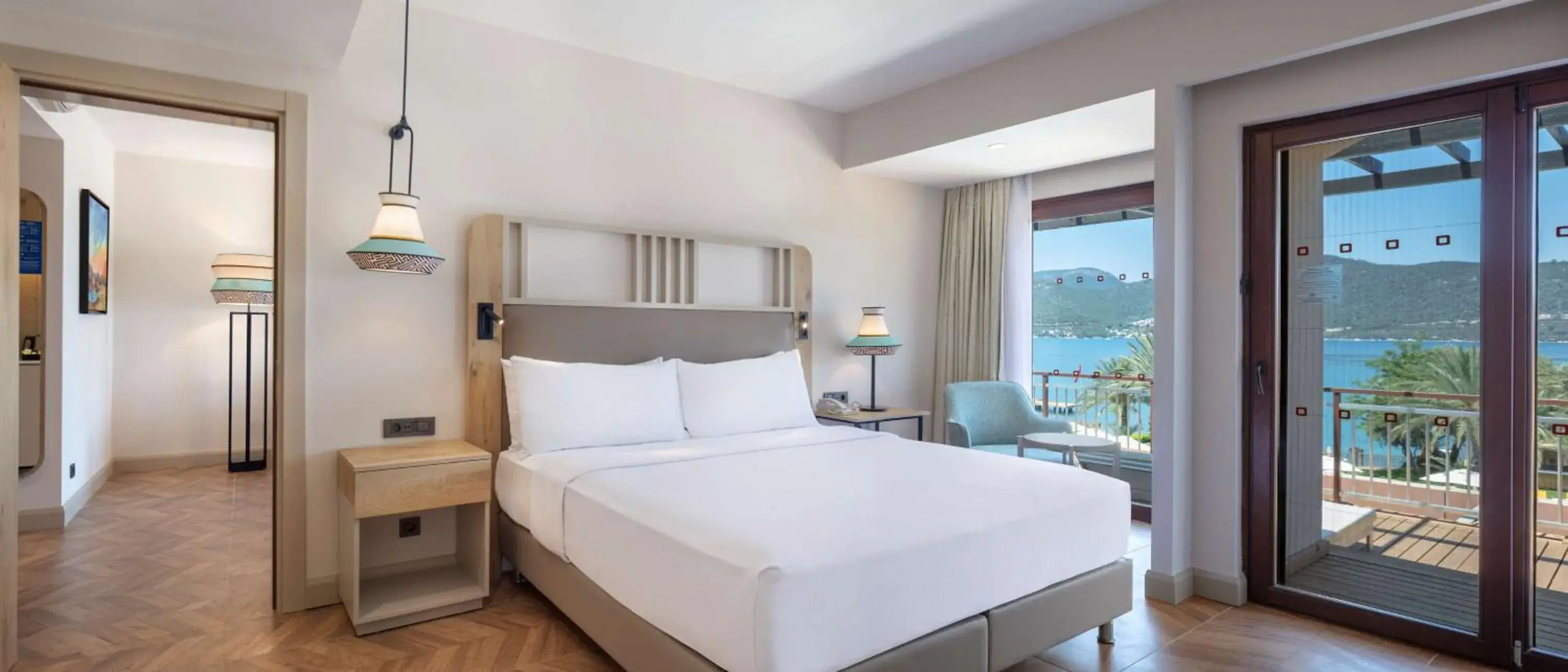 Living room, Bed in DoubleTree by Hilton Bodrum Isil Club Ultra All-Inclusive Resort Living room, Bed in DoubleTree by Hilton Bodrum Isil Club Ultra All-Inclusive Resort