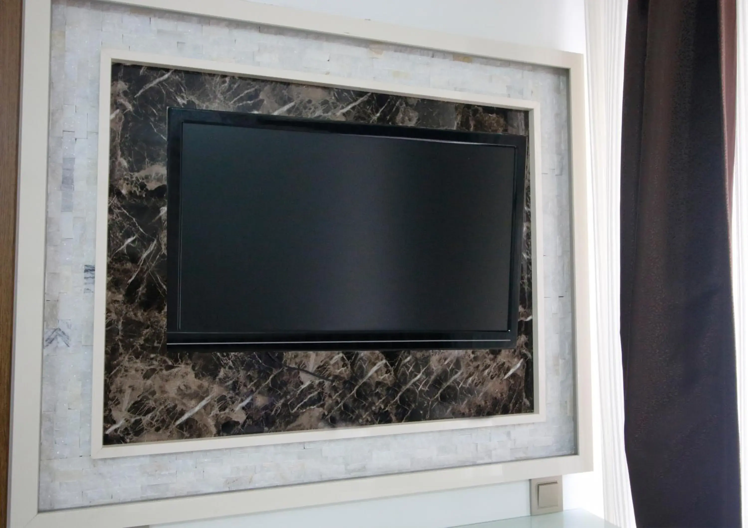 Decorative detail, TV/Entertainment Center in Behram Hotel