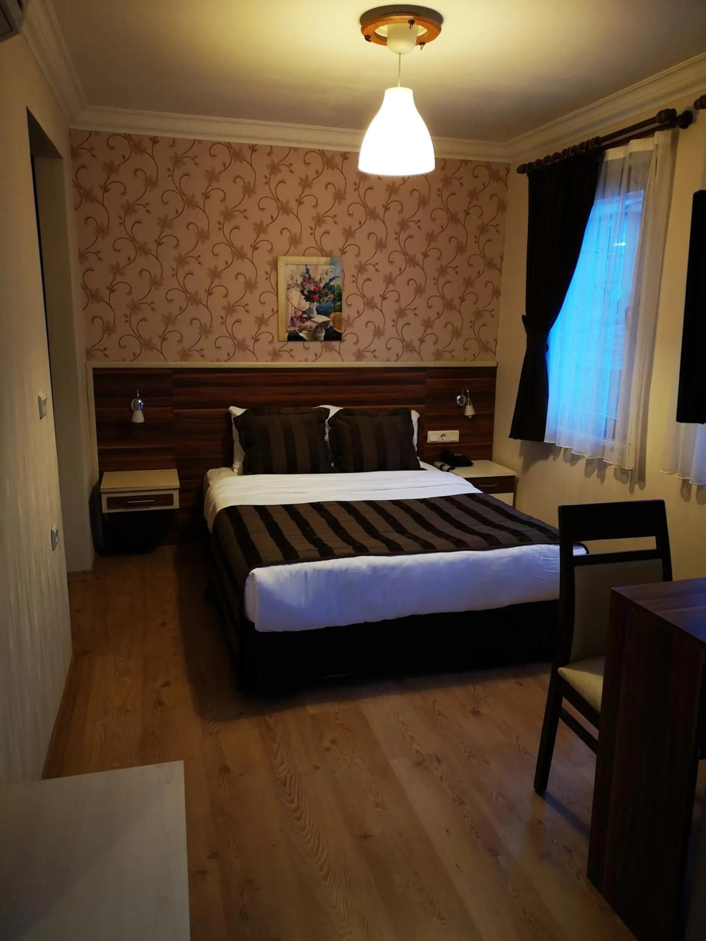 Photo of the whole room, Bed in Angels Garden Hotel - Special Catagory