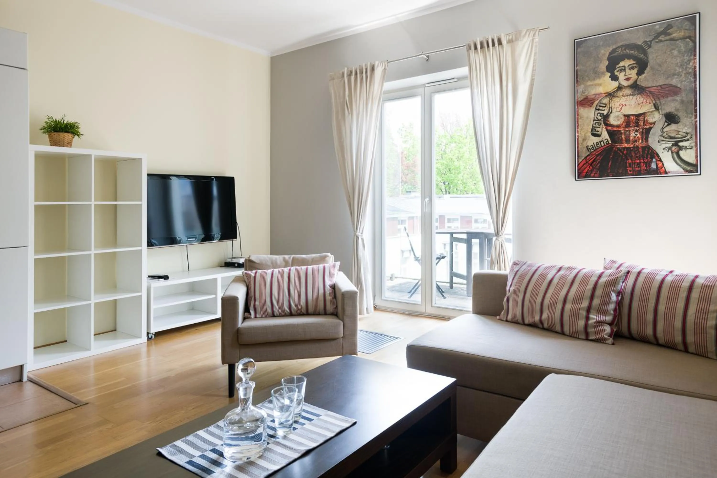 Communal lounge/ TV room in Yourplace Biskupia Old Town Apartments