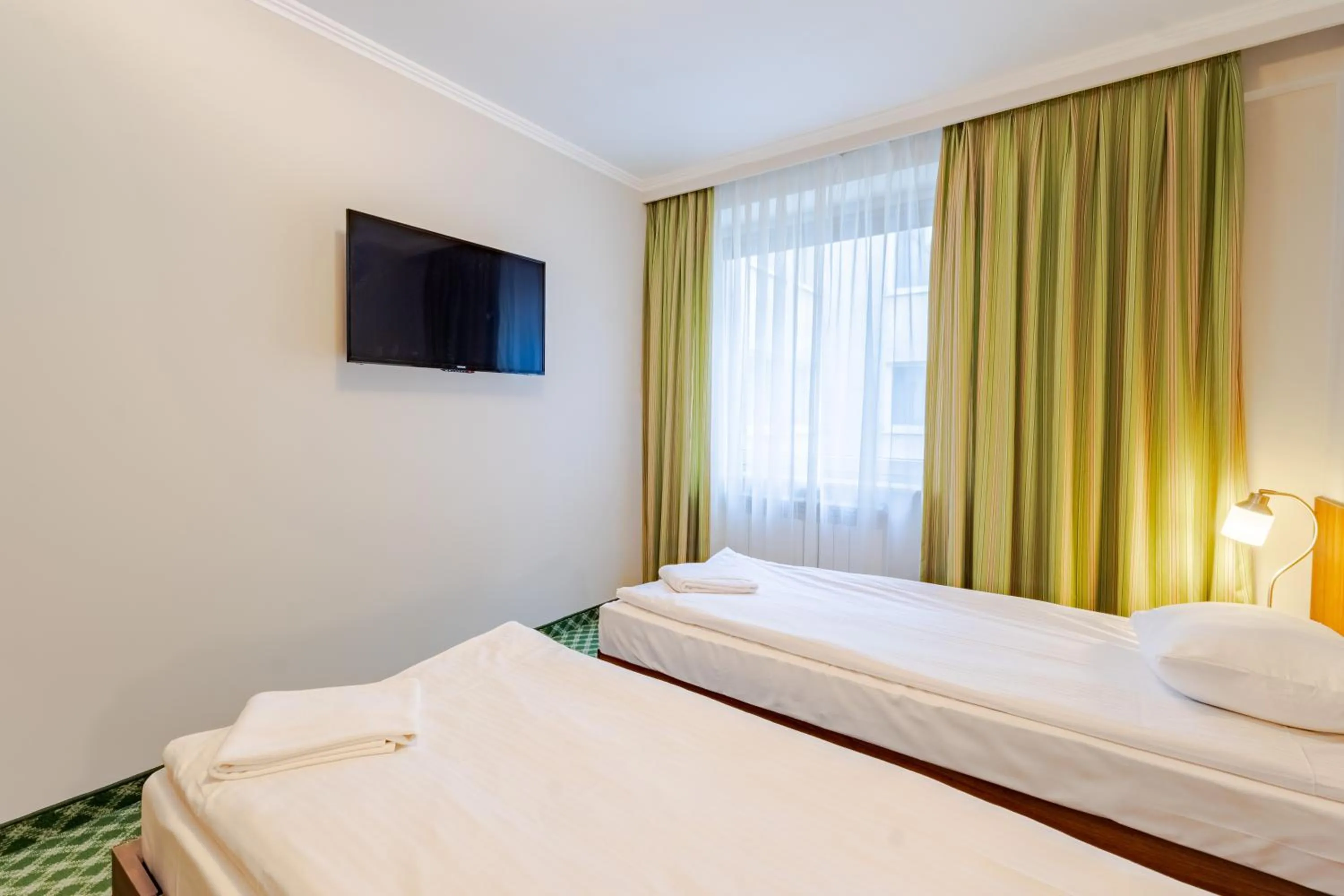 Communal lounge/ TV room, Bed in Hit Hotel