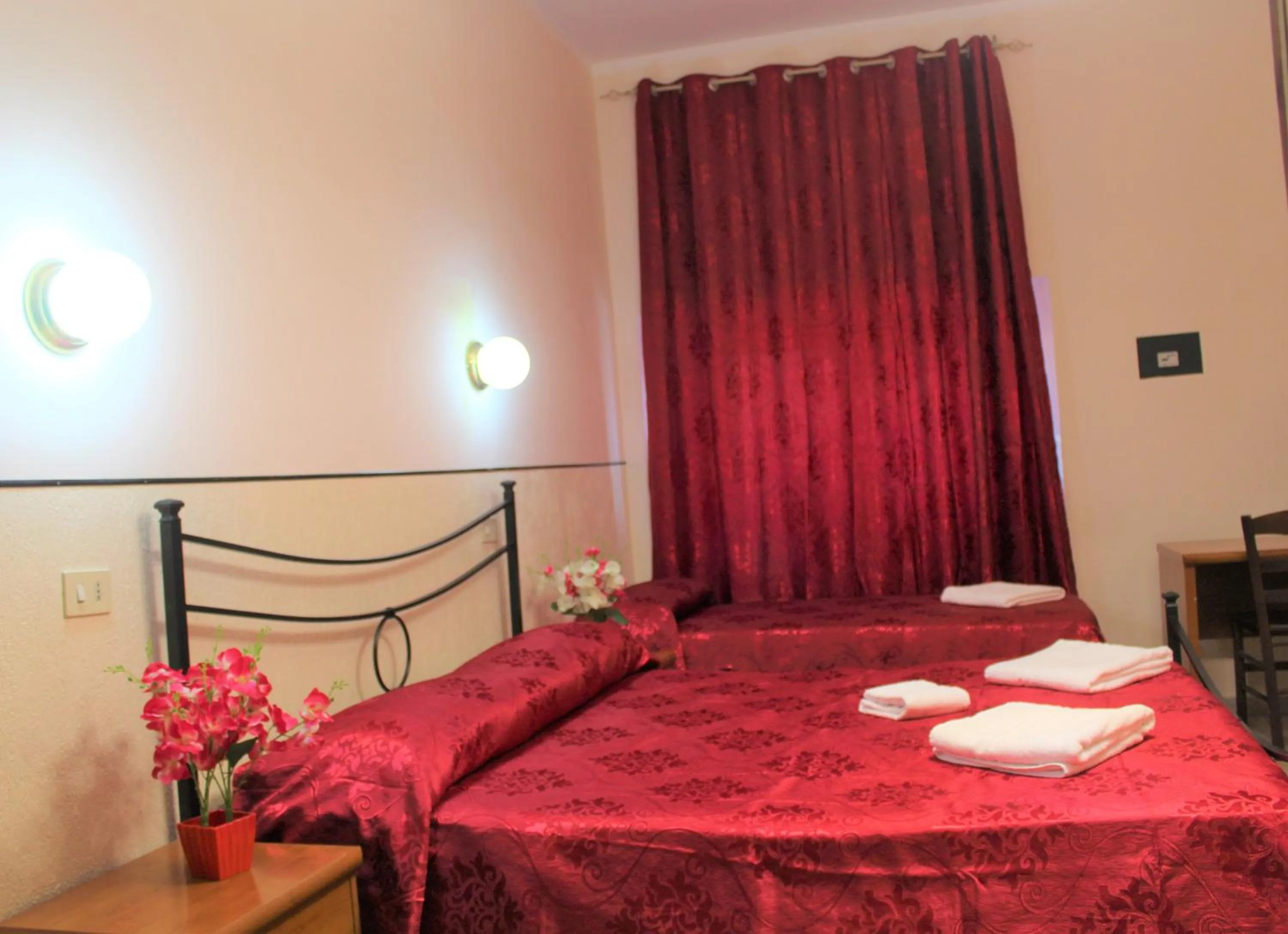 Bed in Hotel Eurorooms