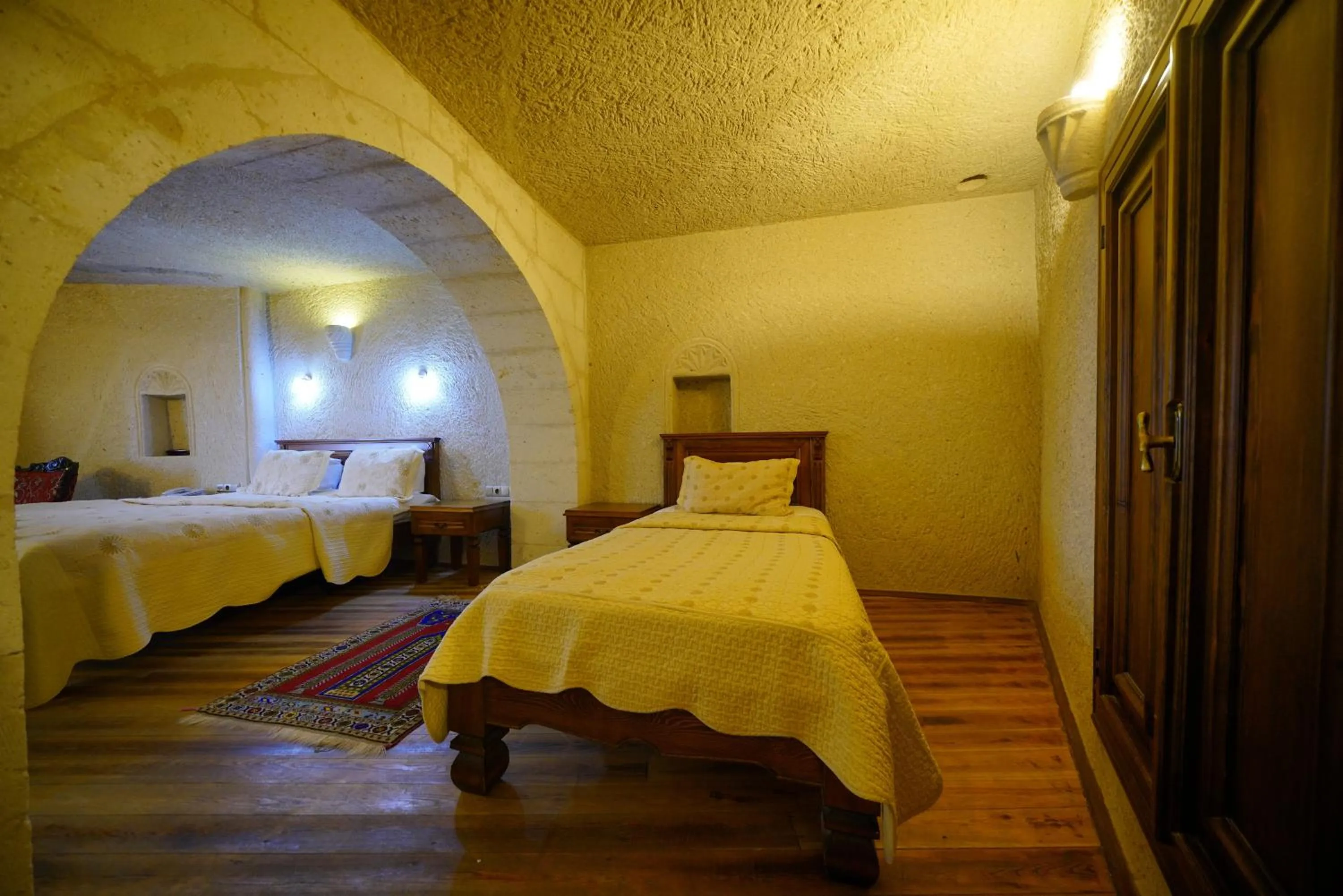 Bed in Vezir Cave Suites