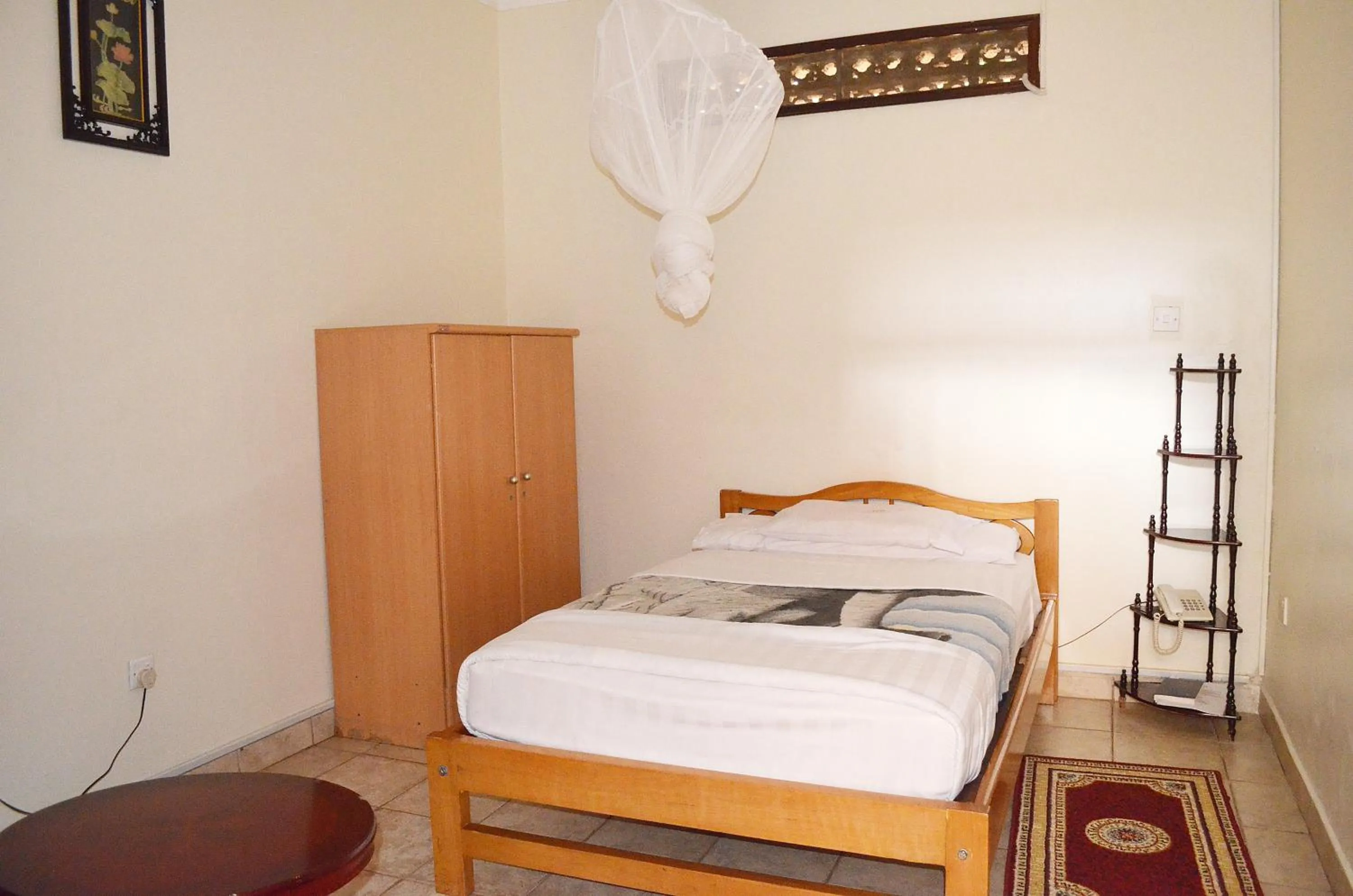 Bed in Victoria Travel Hotel