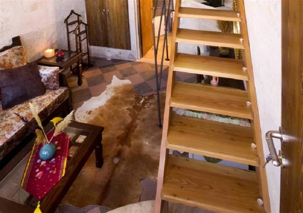 Seating area, Bed in Cappadocia Perimasali Cave Hotel