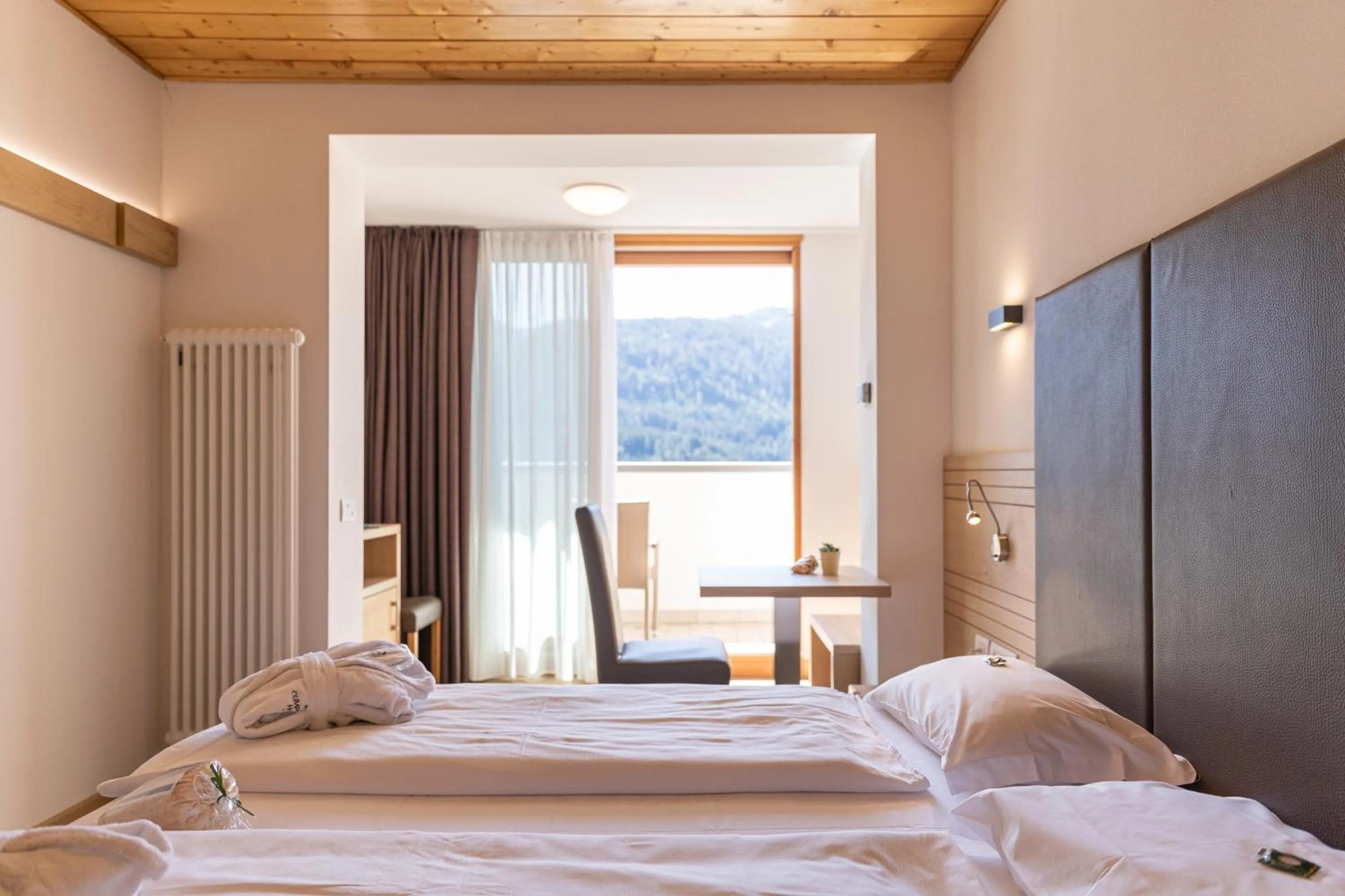 Bed in Olimpionico Hotel