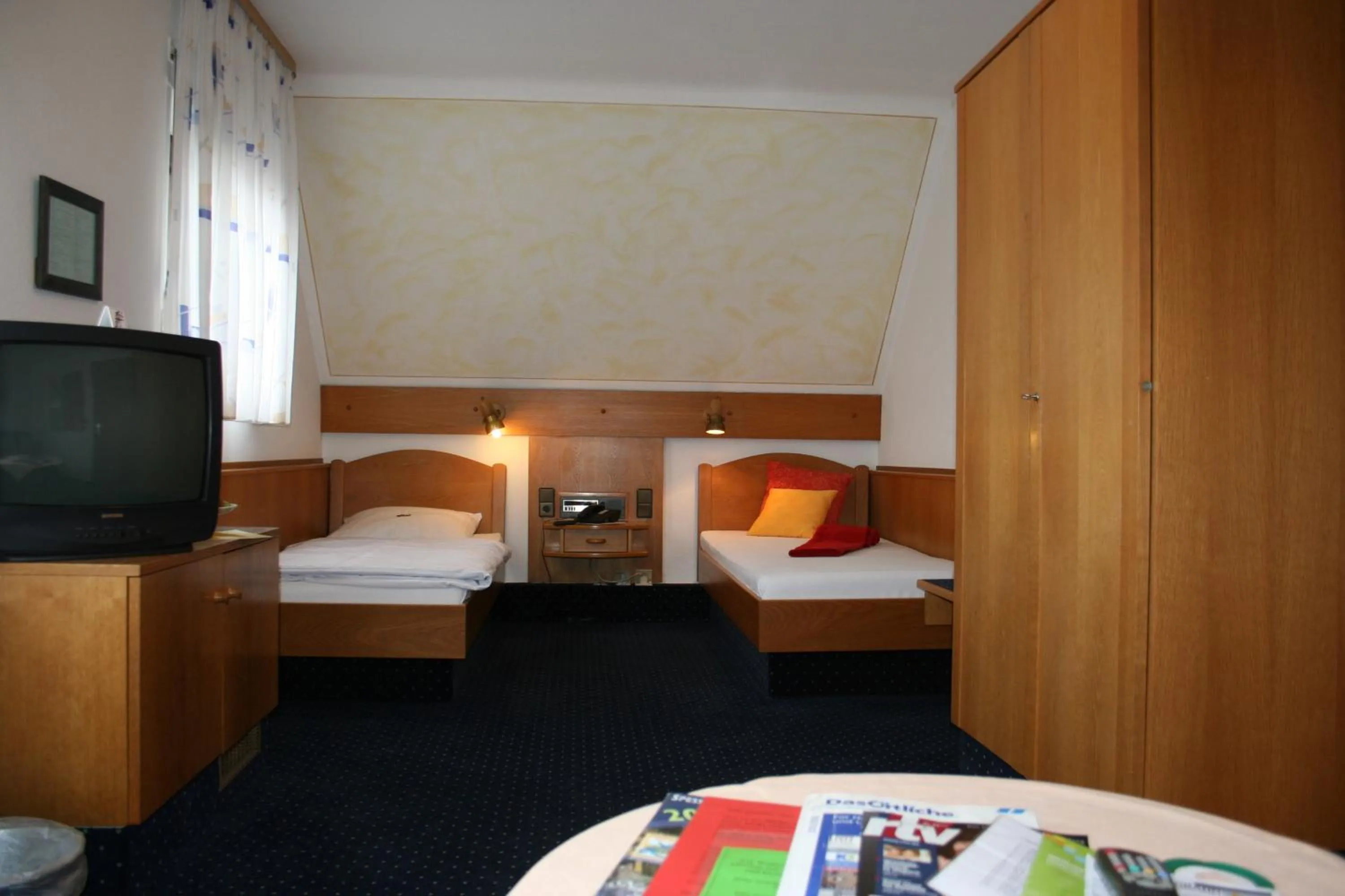 Photo of the whole room, Bed in City Hotel Hanau