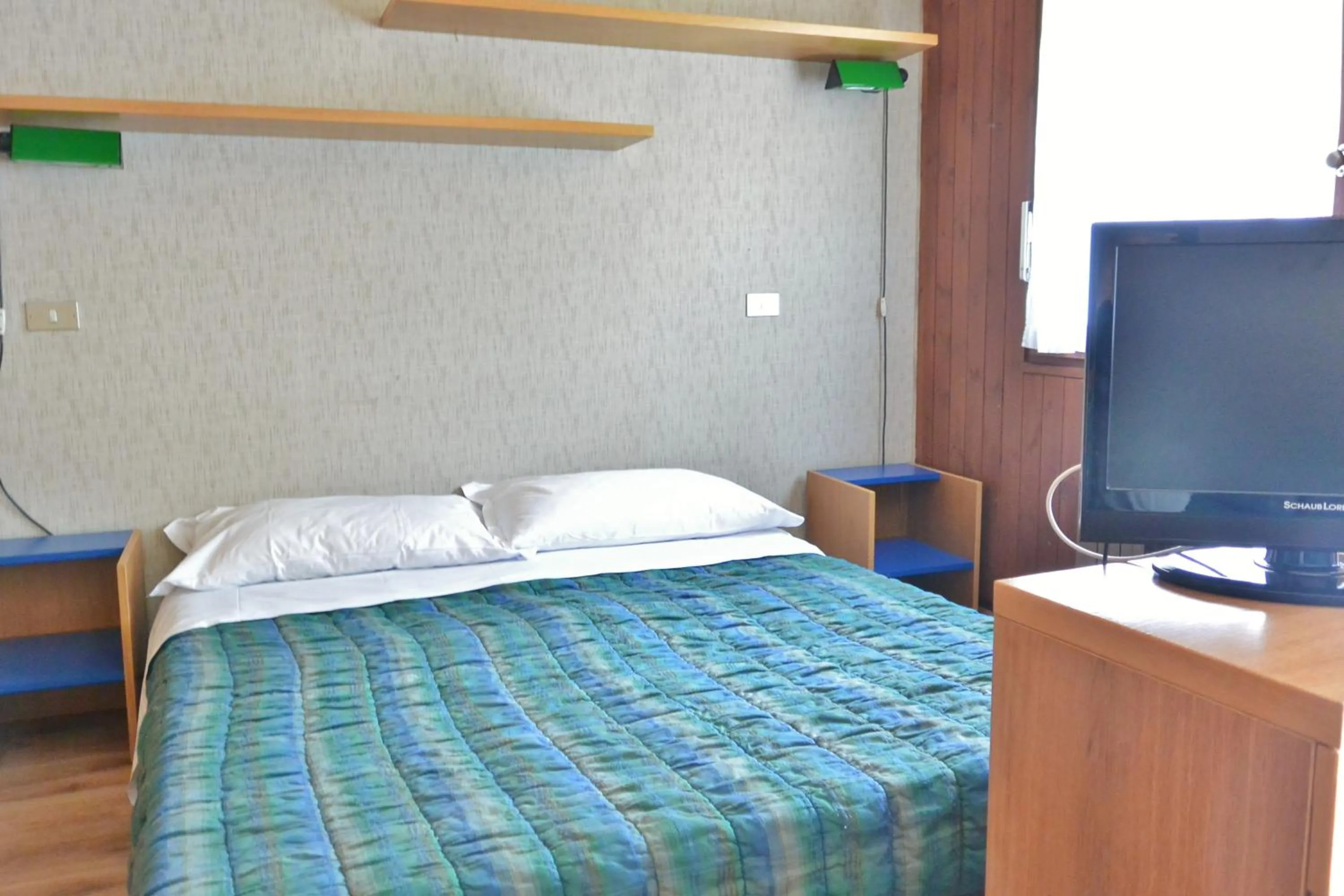 Bed in Appartamenti La Maison de Vacances