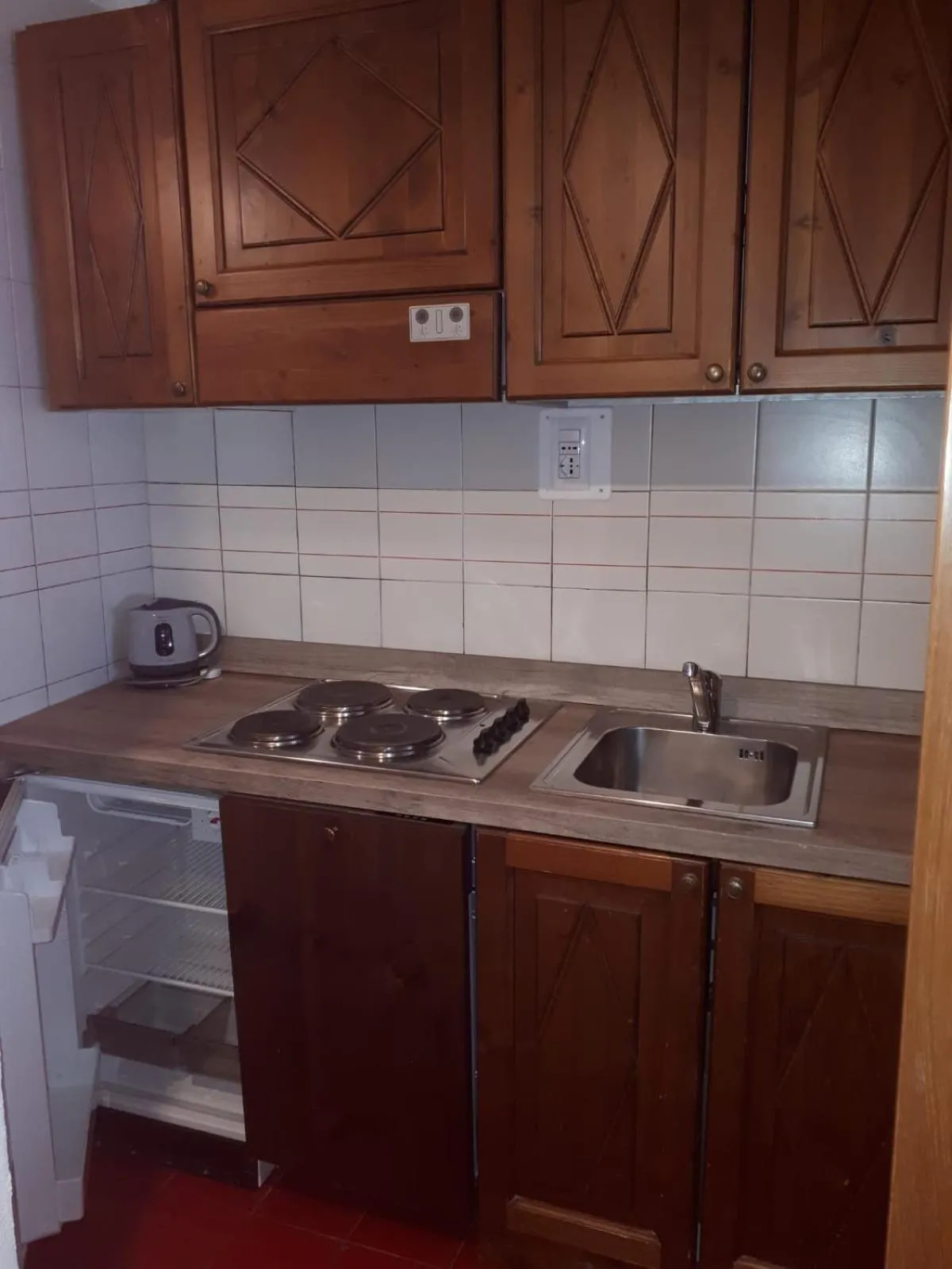 Kitchen or kitchenette in Appartamenti La Maison de Vacances