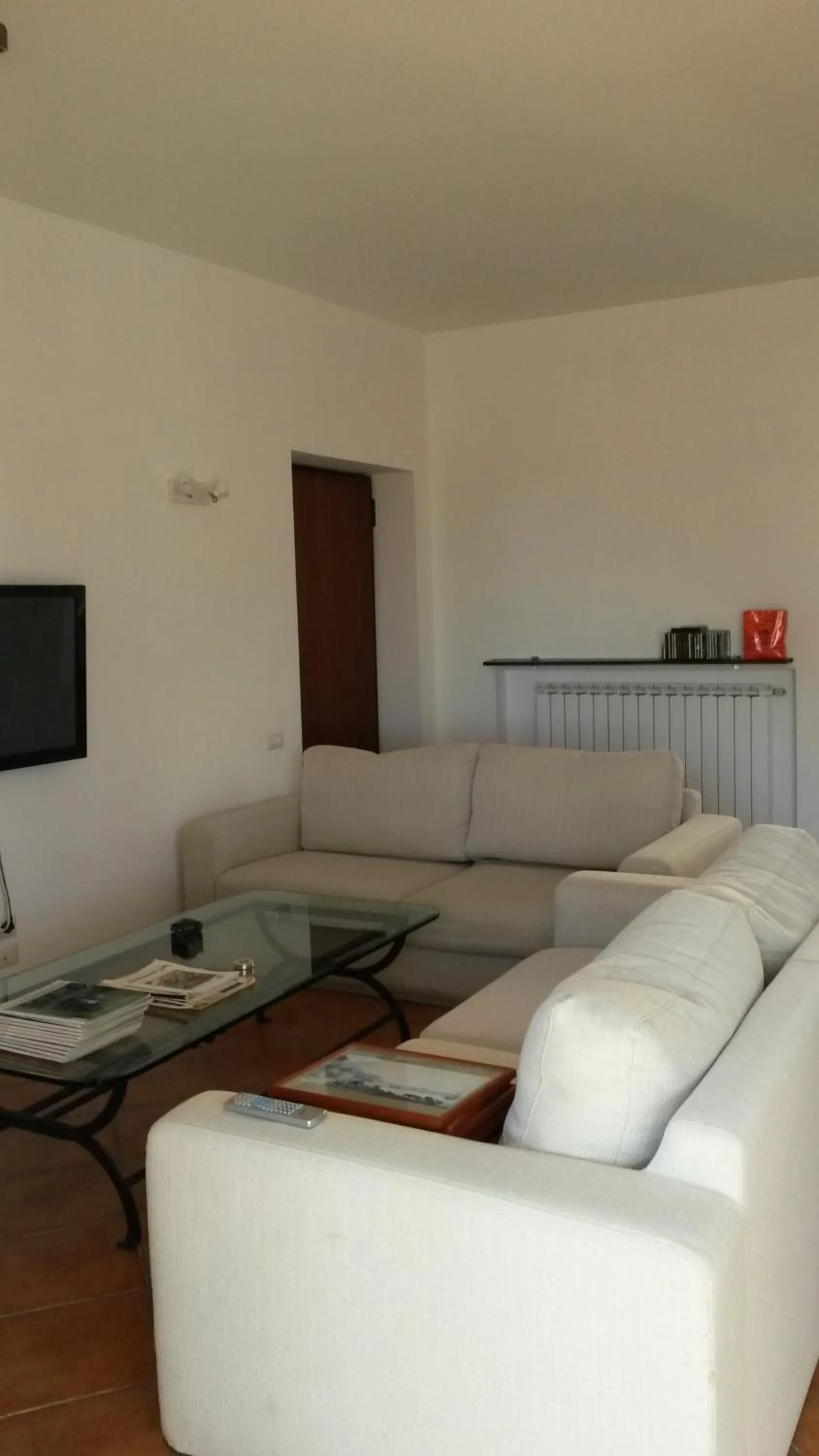 Communal lounge/ TV room in La Casa Del Sole