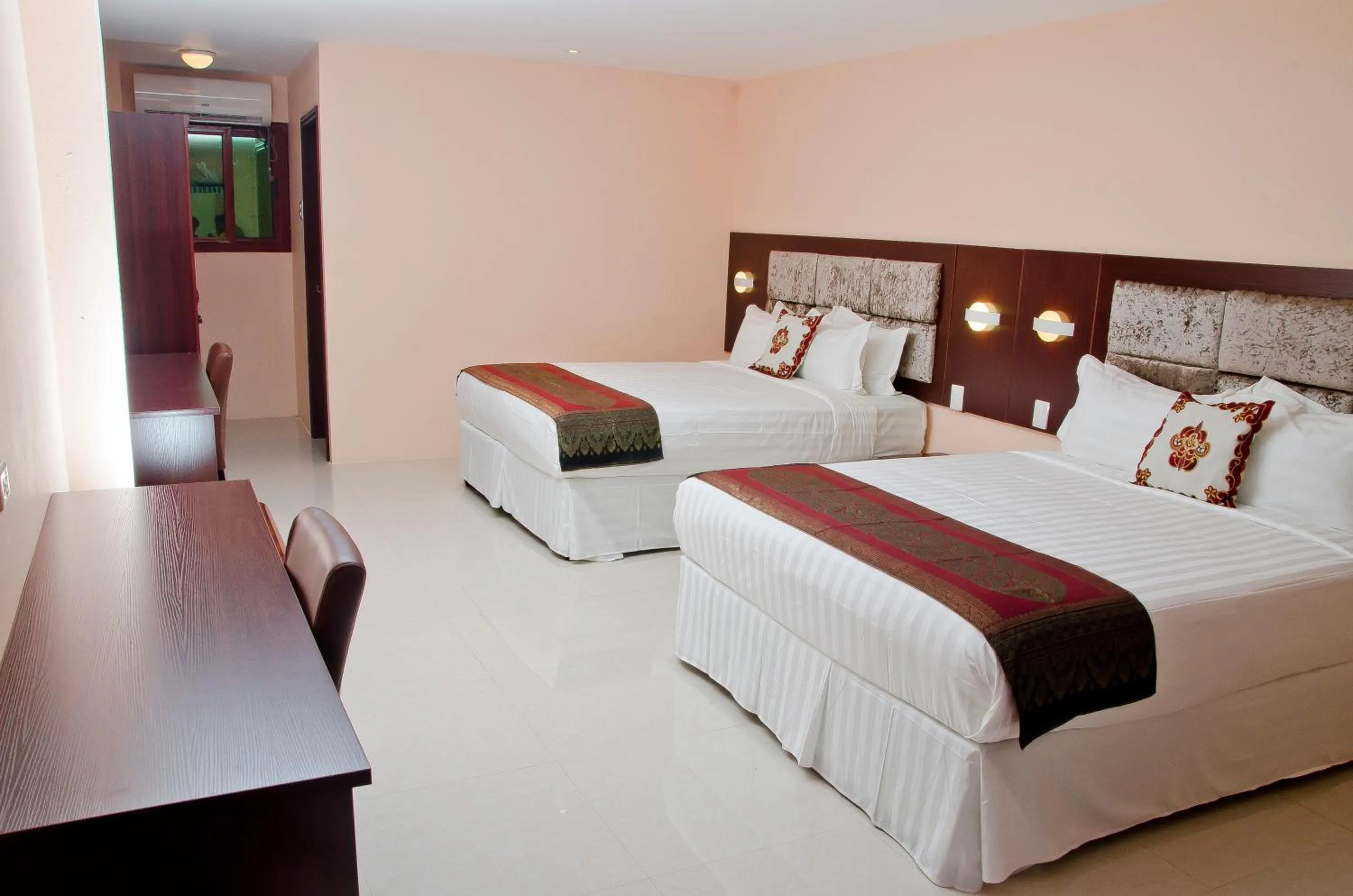 Bed in Grand Diamond Hotel Trinidad