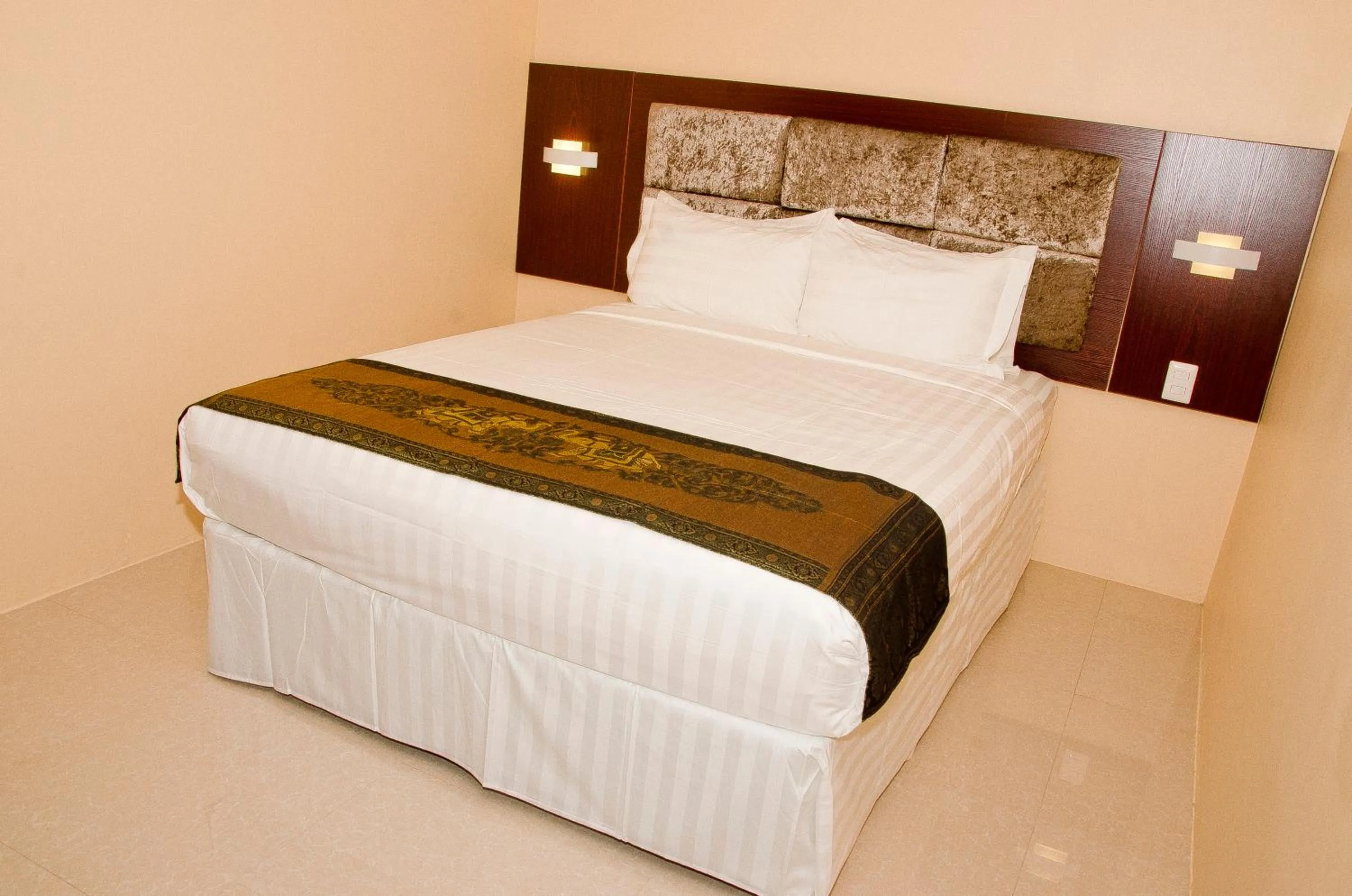 Bed in Grand Diamond Hotel Trinidad