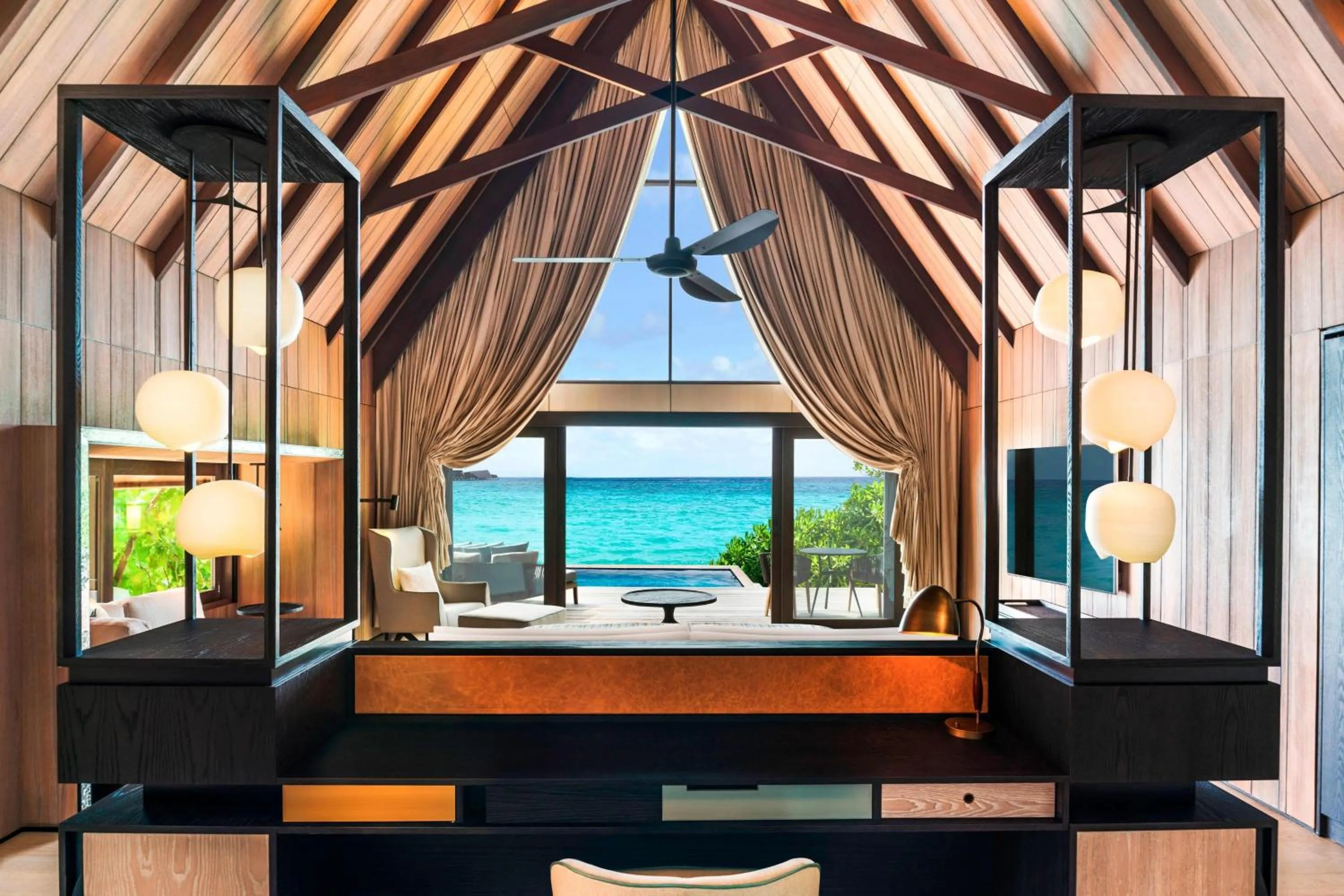 Swimming pool, Bed in The St. Regis Maldives Vommuli Resort