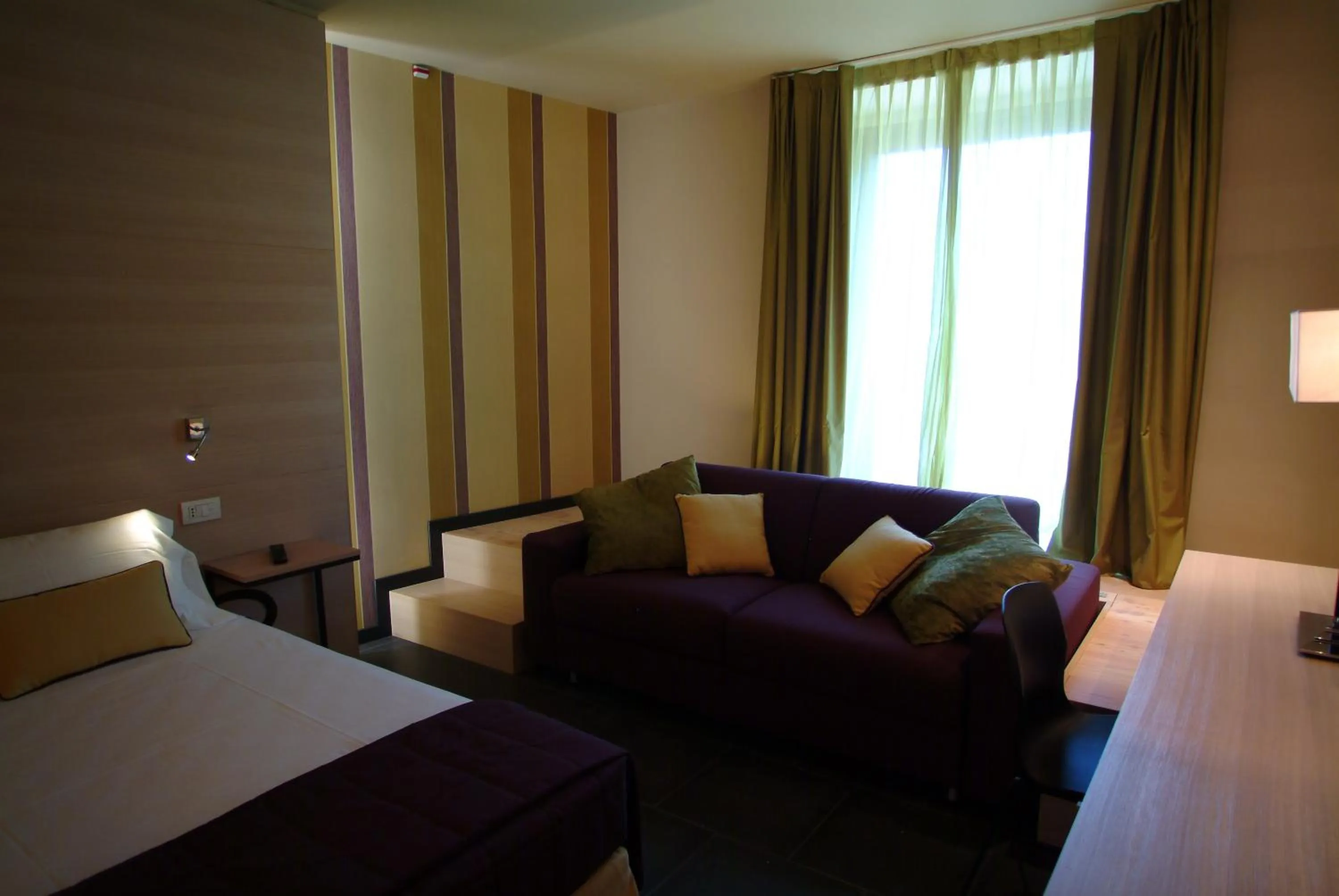 Bed in El Homs Palace Hotel