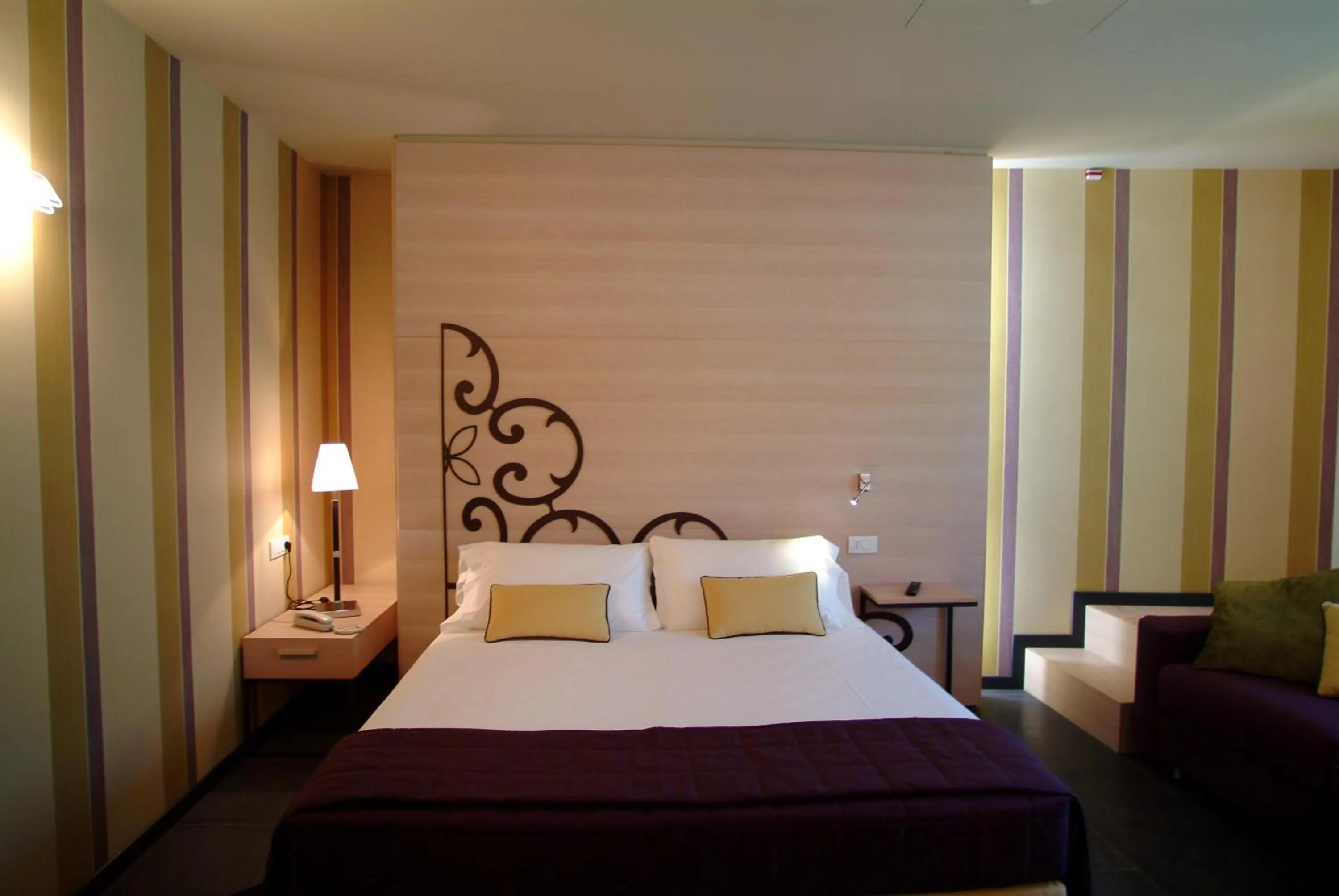 Bed in El Homs Palace Hotel