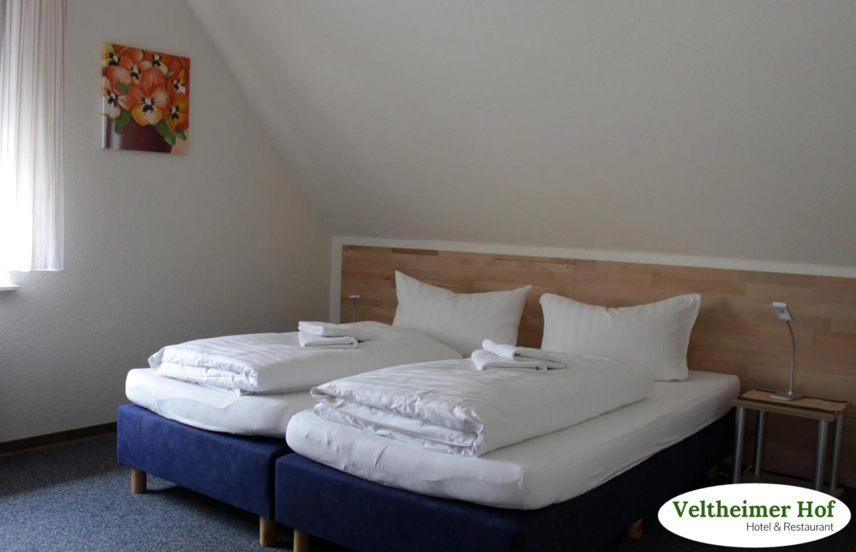 Photo of the whole room, Bed in Landgasthaus Veltheimer Hof