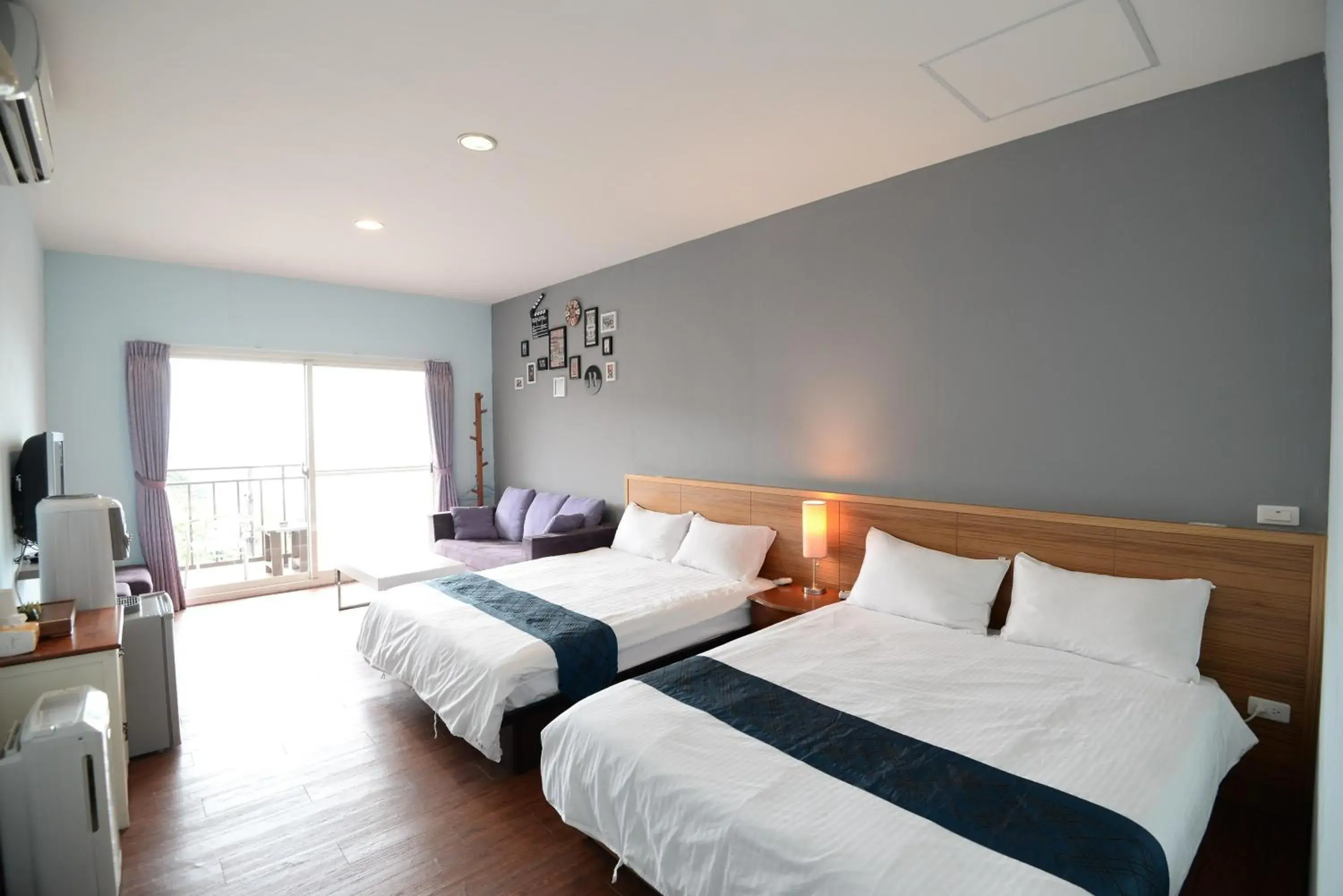Quadruple Room with Balcony in Blue Sky B&B Quadruple Room with Balcony in Blue Sky B&B