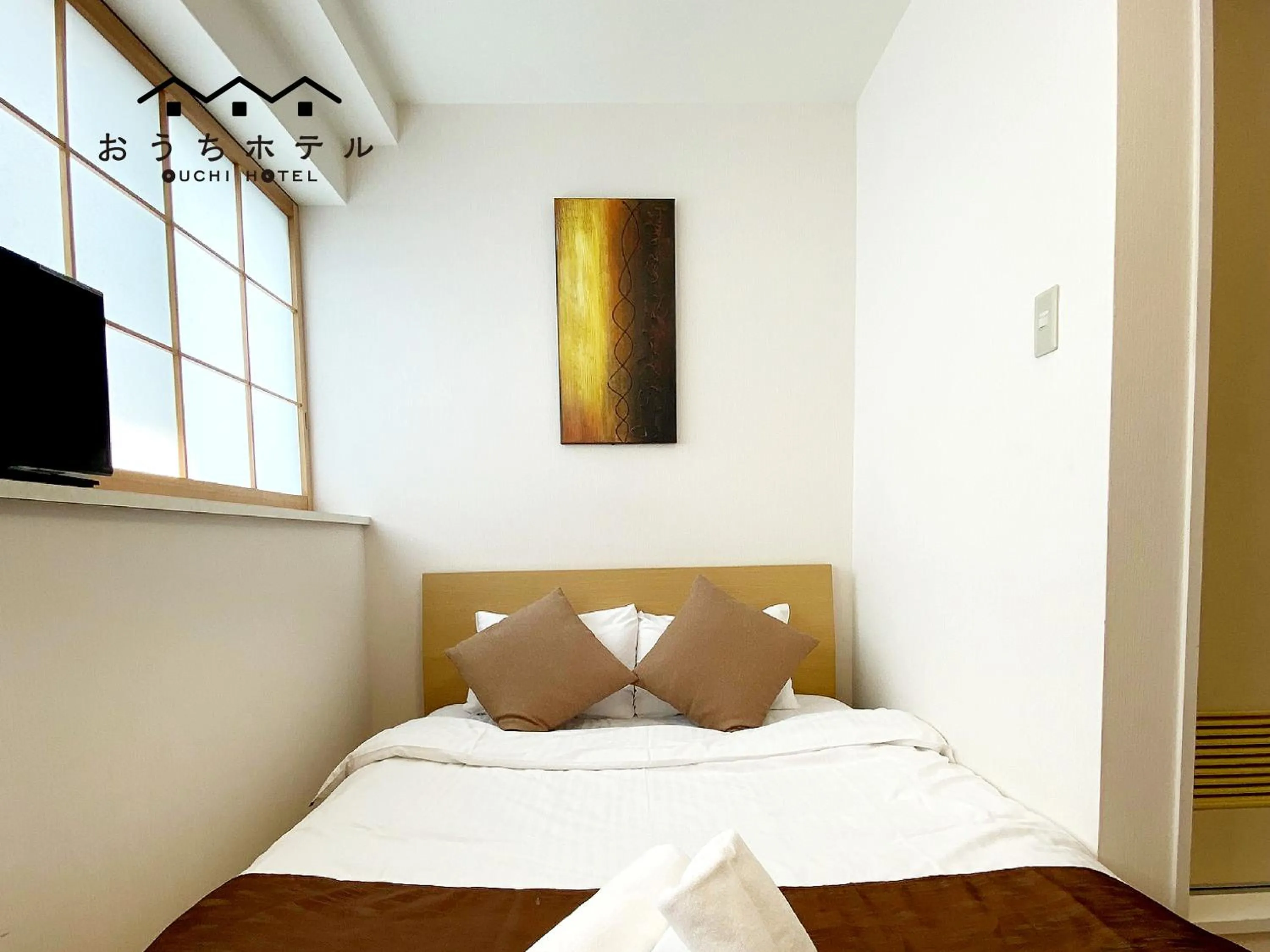 Bed in OUCHI HOTEL Yokogawa