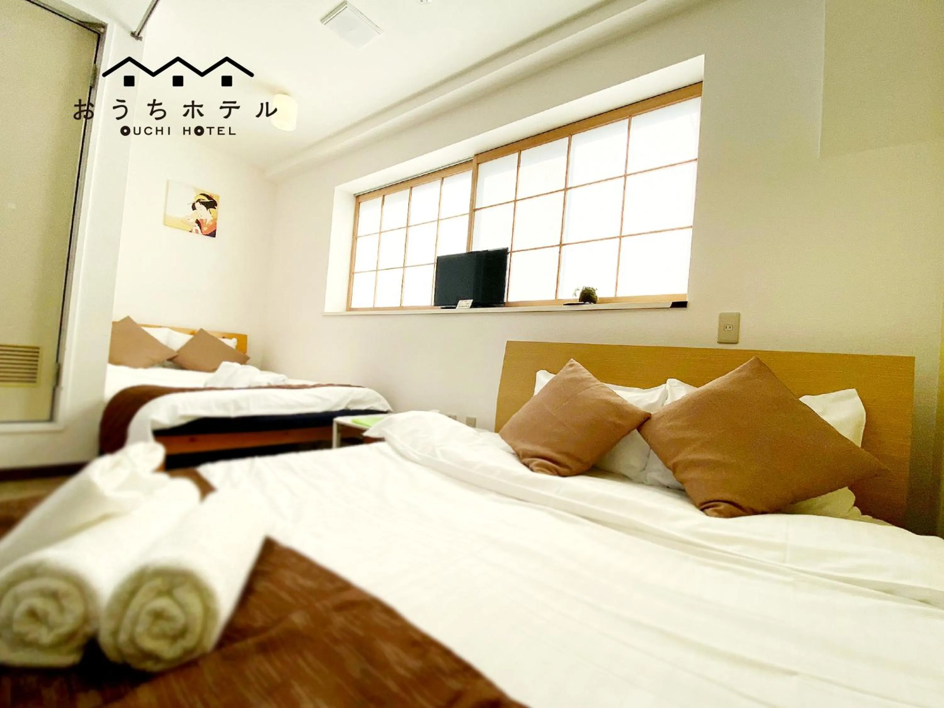 Bed in OUCHI HOTEL Yokogawa